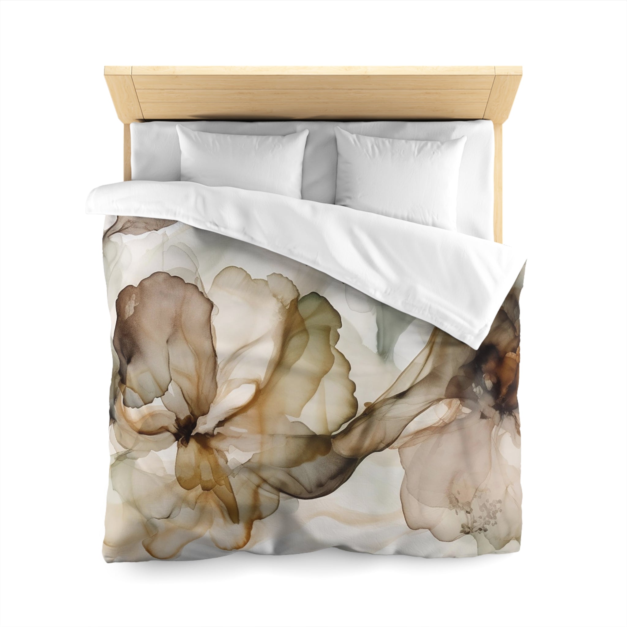 a bed with a floral print duvet cover and pillows.