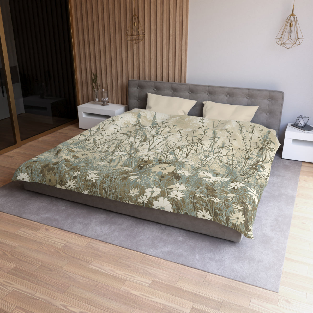 a modern bedroom with a large bed, a gray headboard, and a wooden floor. The bed is covered in a floral print comforter, and there are two pillows on it. The room also features a nightstand, a pendant light, and a mirror.