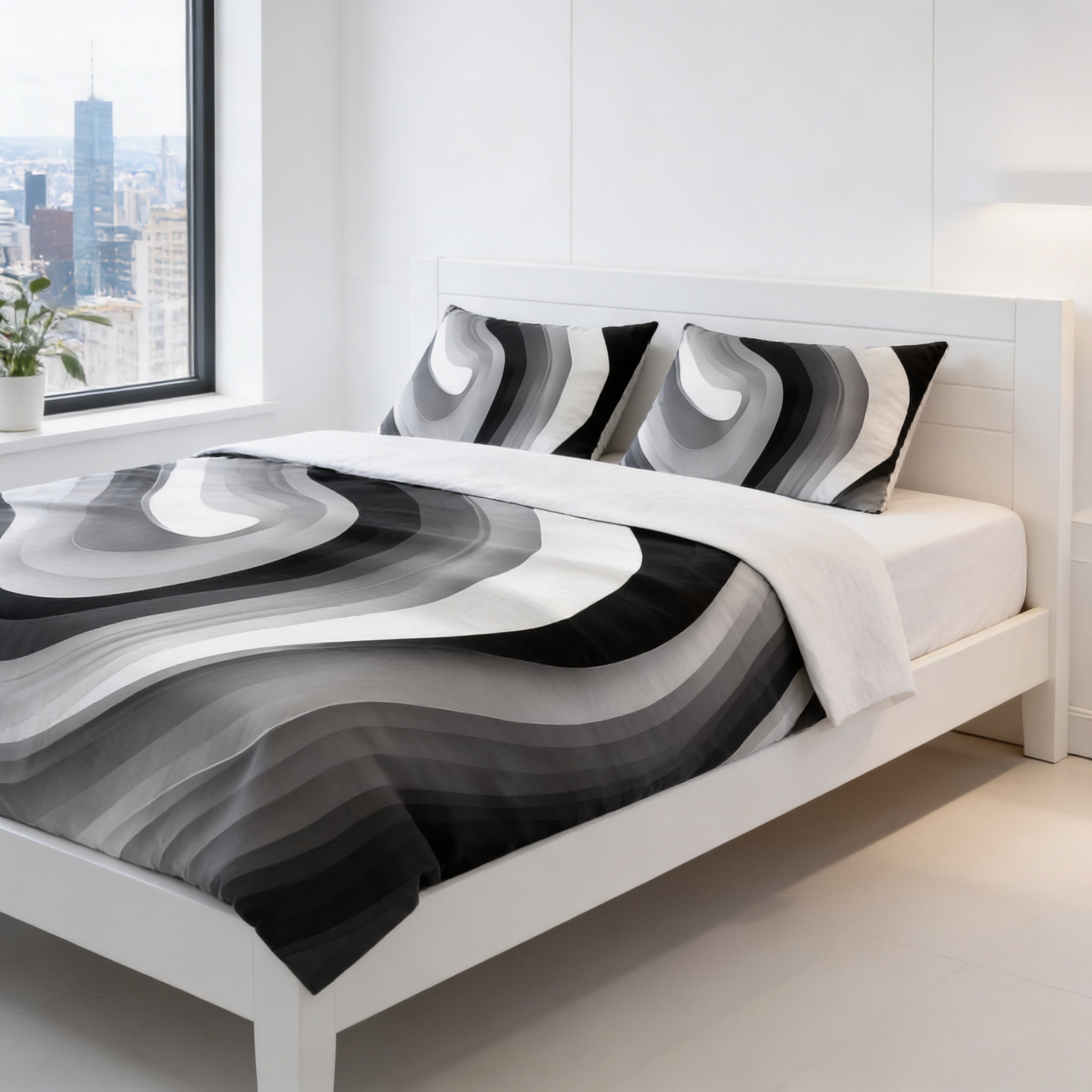 a modern bedroom with a white bed frame and a black and white patterned comforter. The room has a large window overlooking a city skyline, creating a serene and stylish atmosphere.