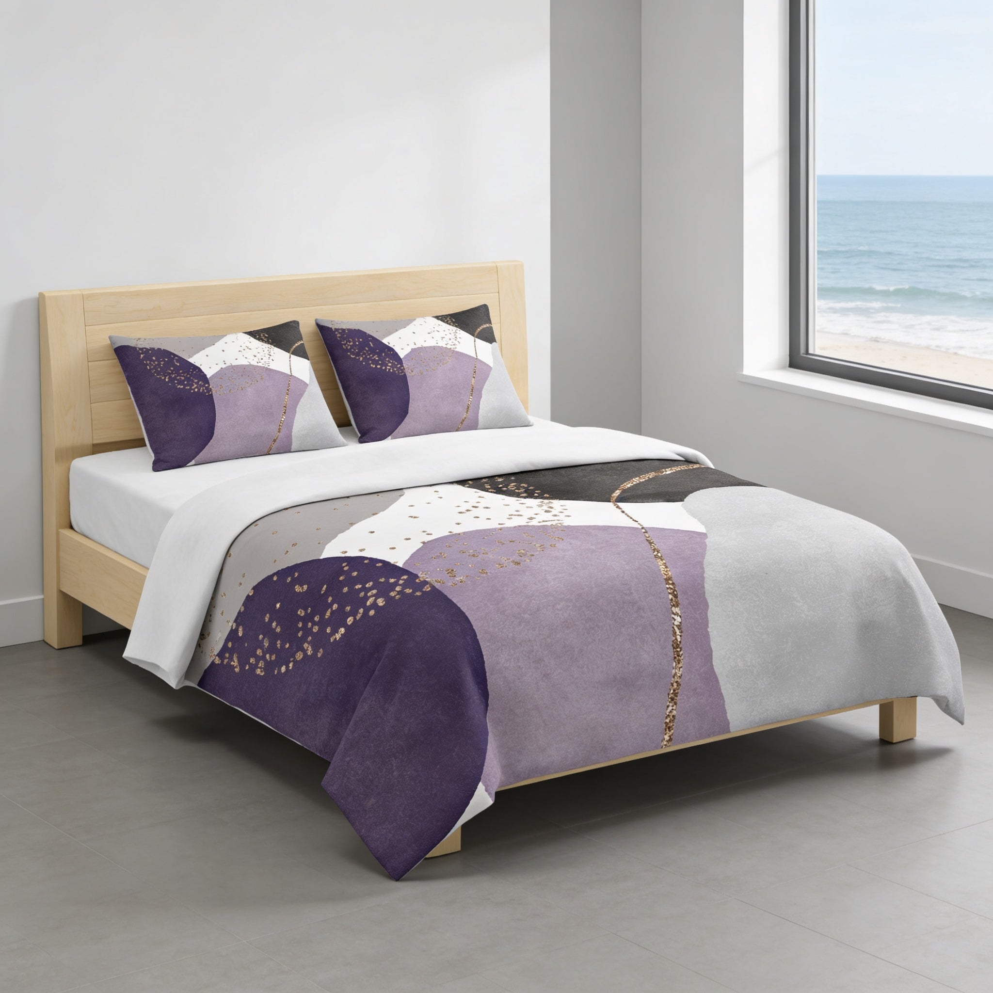 a modern bedroom with a bed featuring a purple and white abstract patterned comforter and matching pillows. The bed is positioned against a wall with a large window overlooking the ocean.