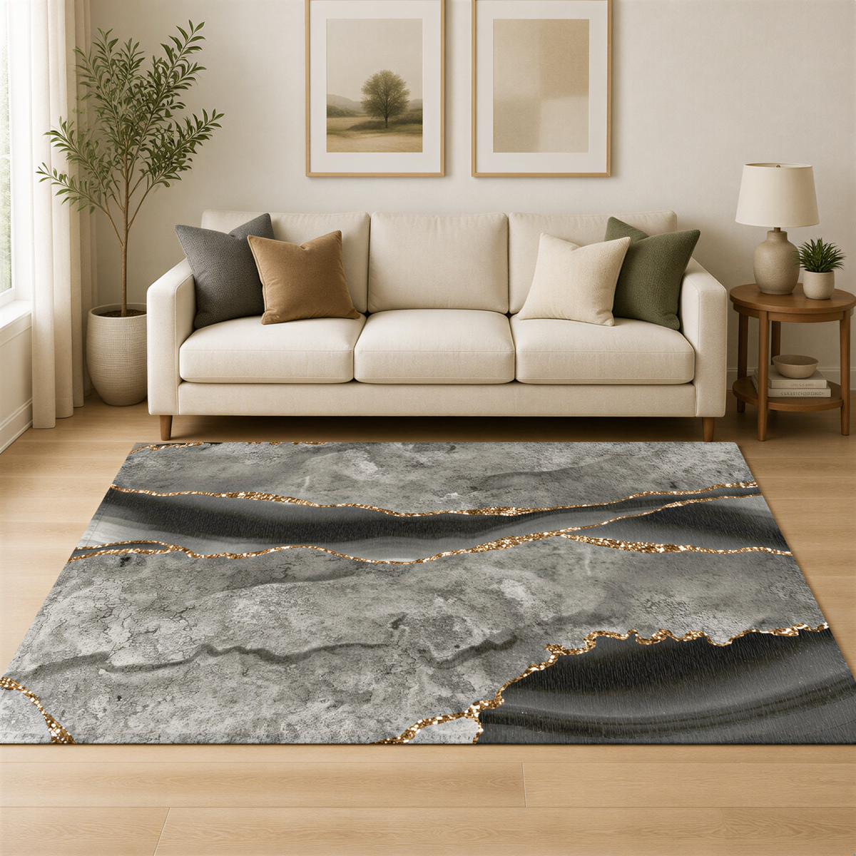 a living room with a white sofa, a gray and gold rug, and two framed landscape paintings on the wall.