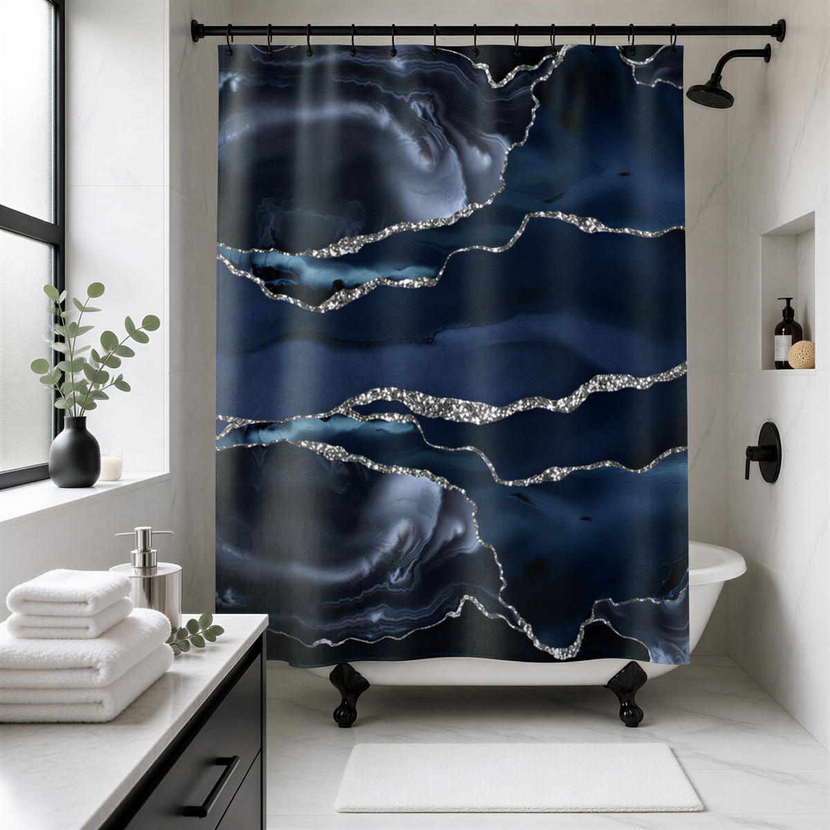 a bathroom with a large, dark blue and silver marble-like shower curtain. The curtain has a striking design with silver glitter accents that add a touch of elegance to the space. The bathroom also includes a white bathtub, a sink, and a potted plant, creating a stylish and modern aesthetic.