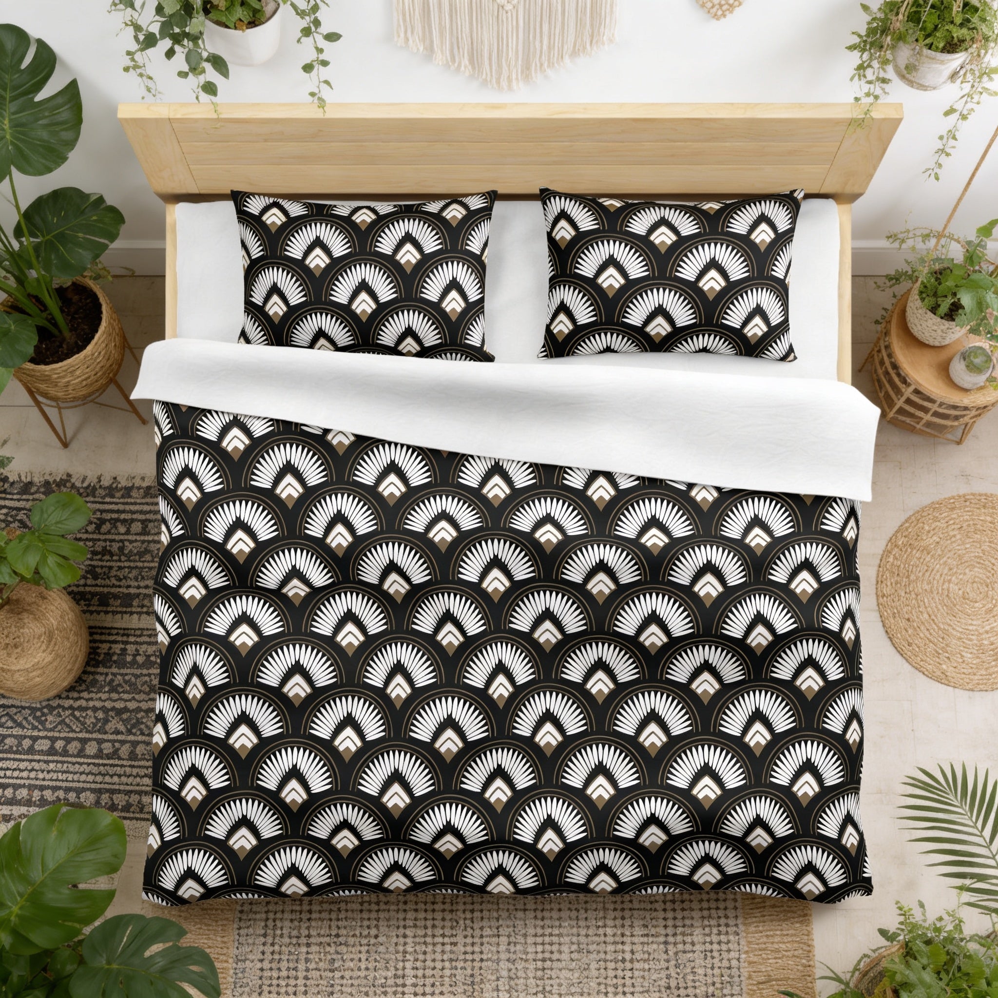 a bedroom with a bed featuring a black and white patterned comforter and pillows. The bed is surrounded by various potted plants, creating a cozy and natural atmosphere.