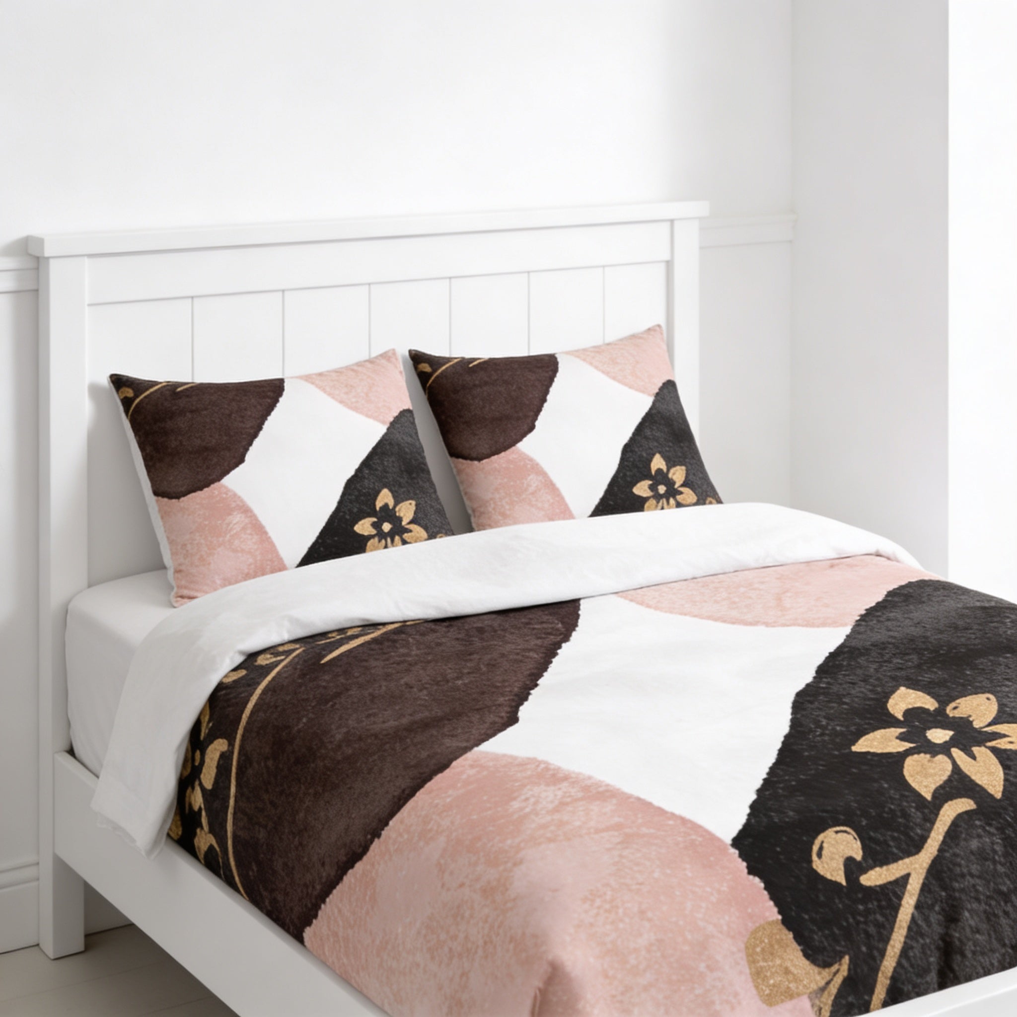 A white bed with a colorful, abstract patterned comforter and pillows.