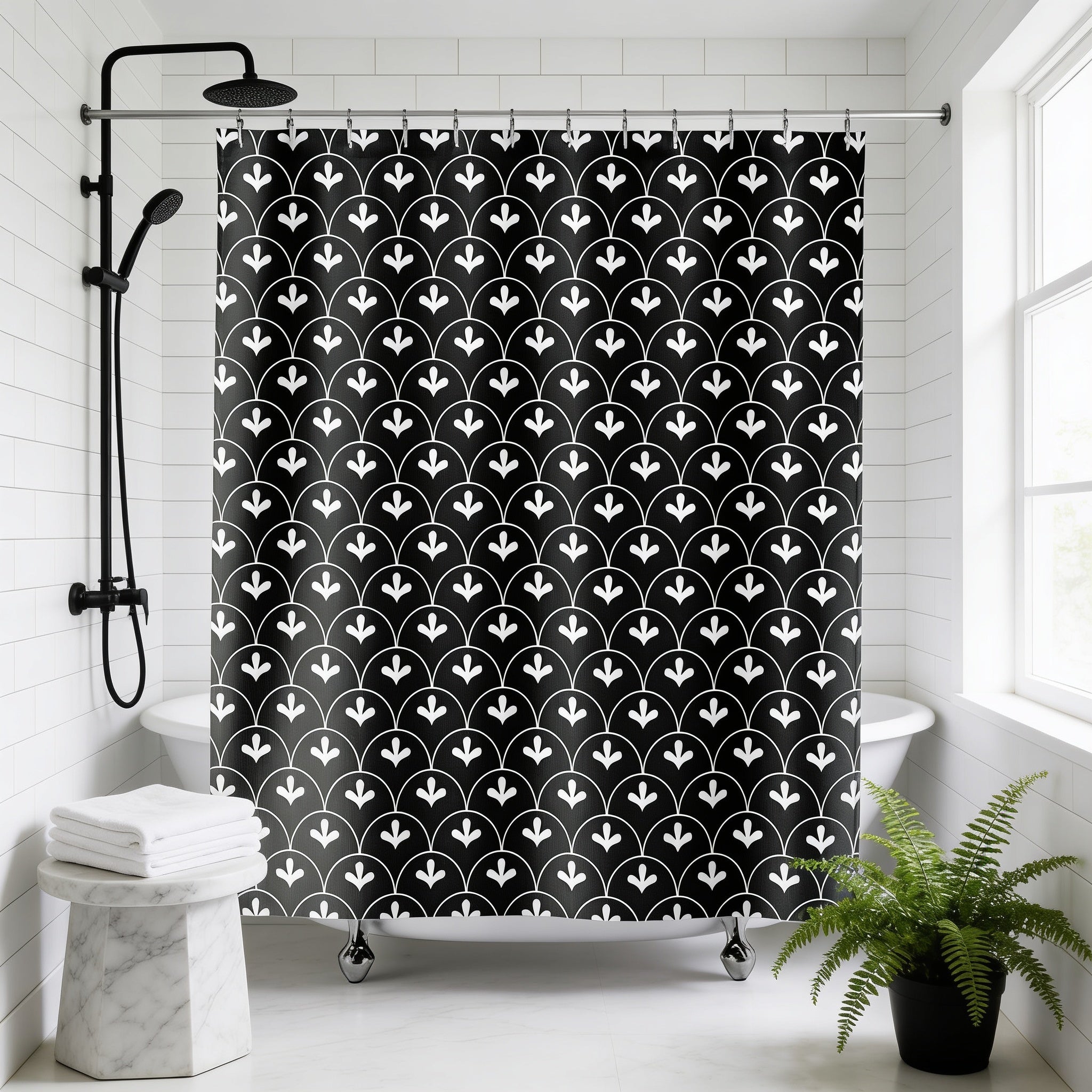 a bathroom with a black and white patterned shower curtain, a white bathtub, a marble stool, and a potted plant.