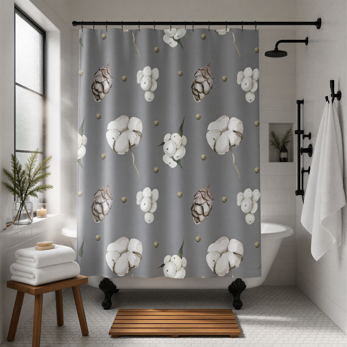 a bathroom with a gray shower curtain featuring a repeating pattern of white flowers and pine cones. The shower curtain is hanging from a rod above a white bathtub. The bathroom also includes a wooden stool, a towel rack, and a potted plant, creating a cozy and inviting atmosphere.