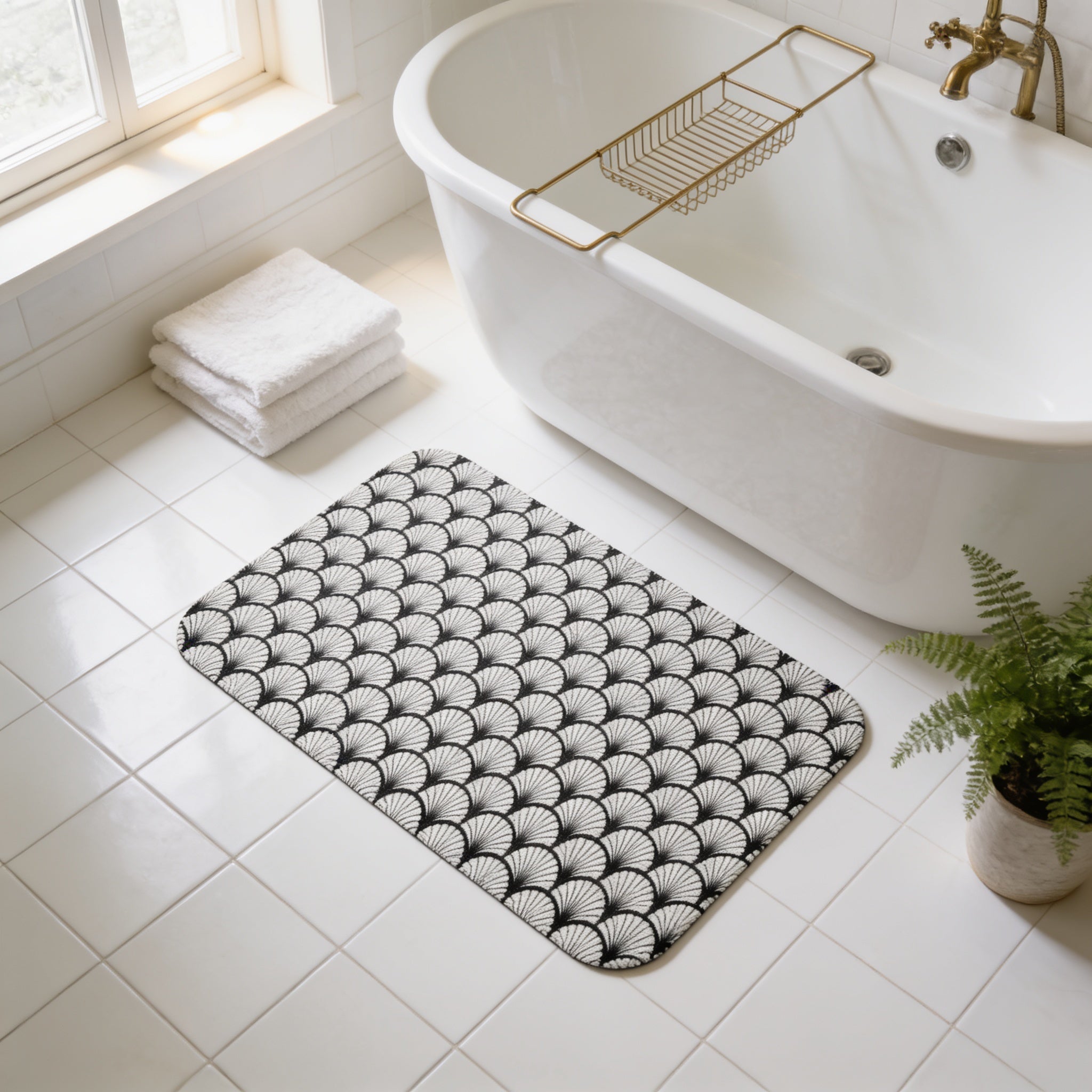 a bathroom with a white bathtub, a black and white patterned bath mat, and a potted plant.