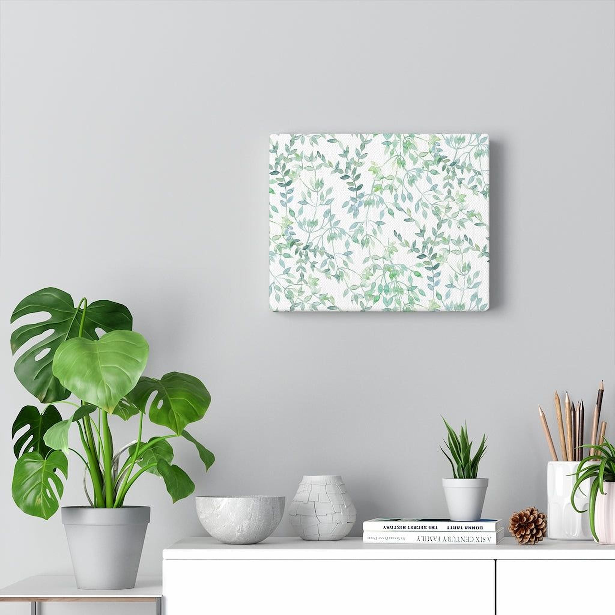 a minimalist living space with a gray wall, a white shelf, and a variety of potted plants and decorative items.