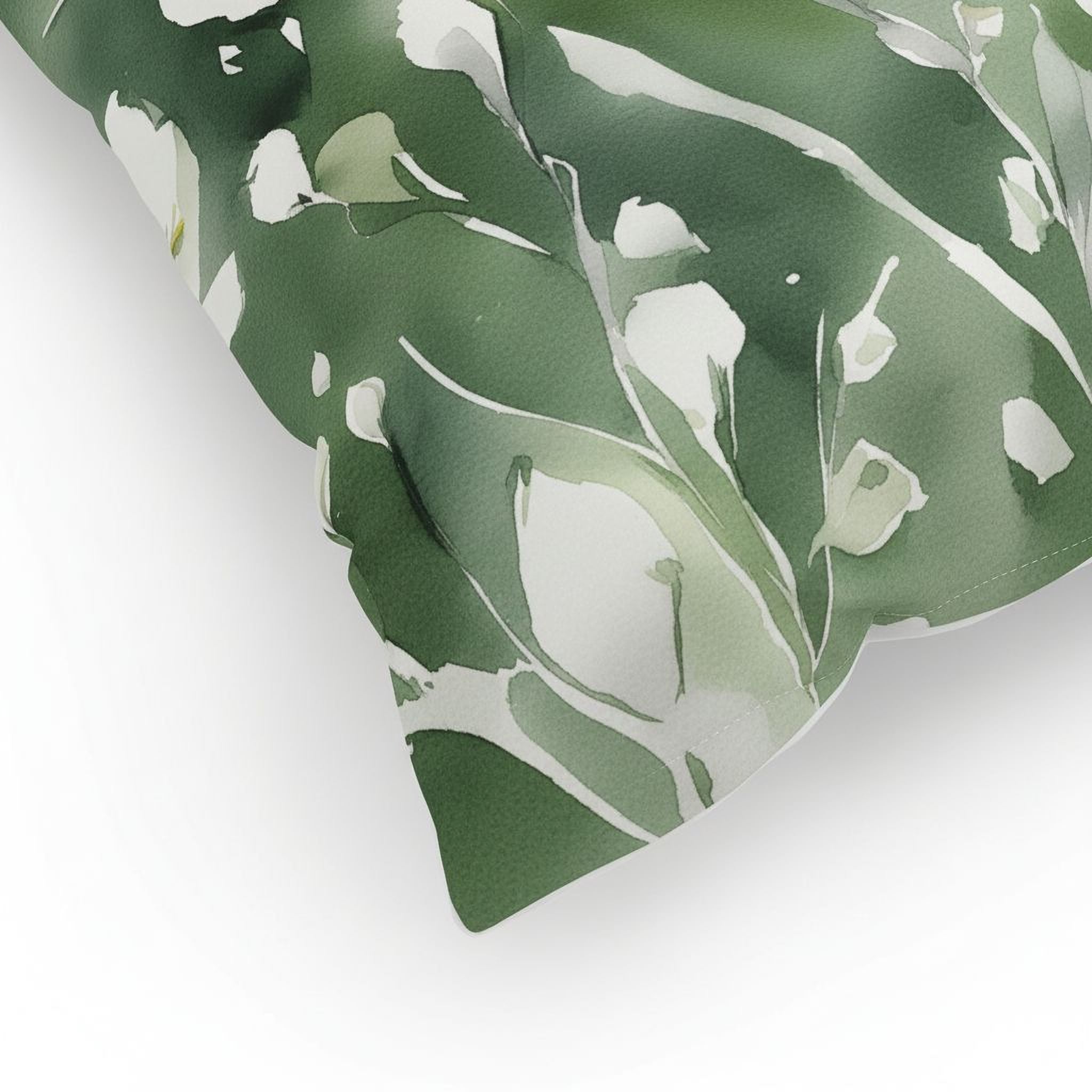 a close-up view of a green and white leaf pattern on a surface.