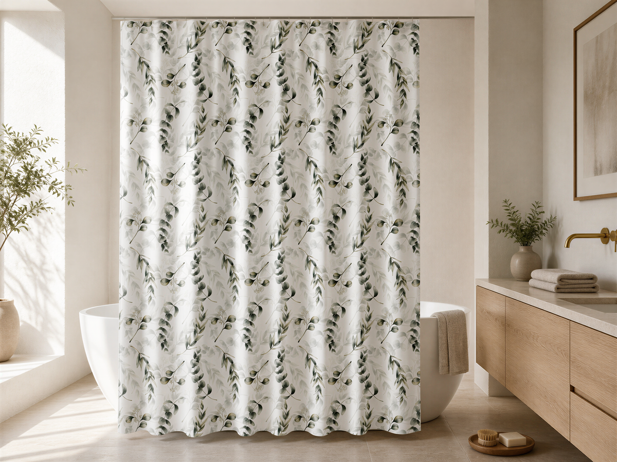 a modern bathroom with a shower curtain featuring a leaf pattern. The bathroom has a wooden vanity and a large window, creating a serene and natural atmosphere.