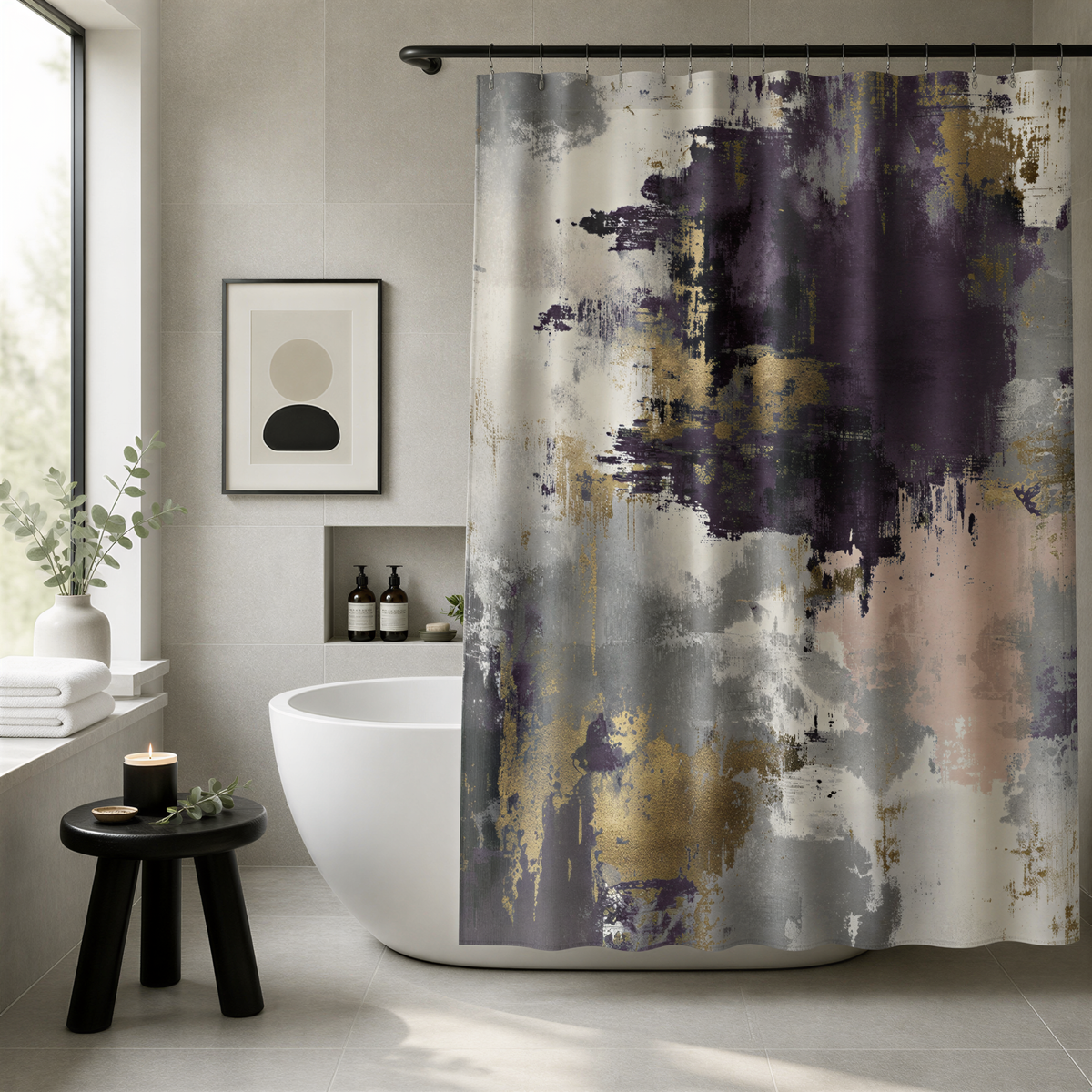 a modern bathroom with a large abstract shower curtain featuring a mix of purple, gray, and gold colors. The bathroom is well-decorated with a white freestanding bathtub, a small table with a candle, and a framed artwork on the wall.