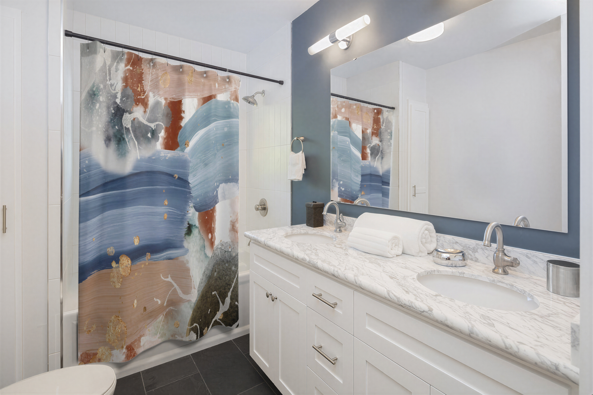 Abstract Shower Curtain Blue Beige hanging in a bathroom