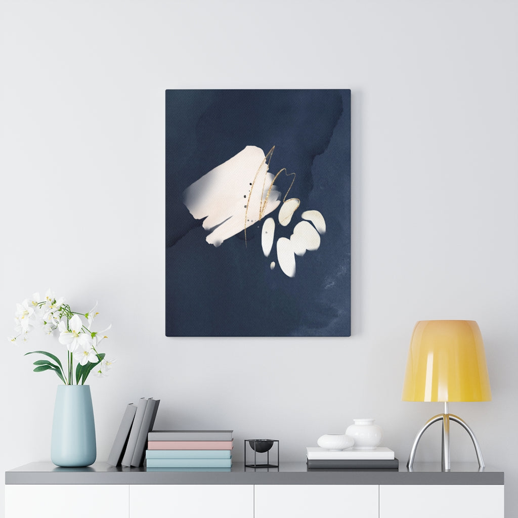 Navy blue, cream and white abstract wall canvas art in a bedroom setting