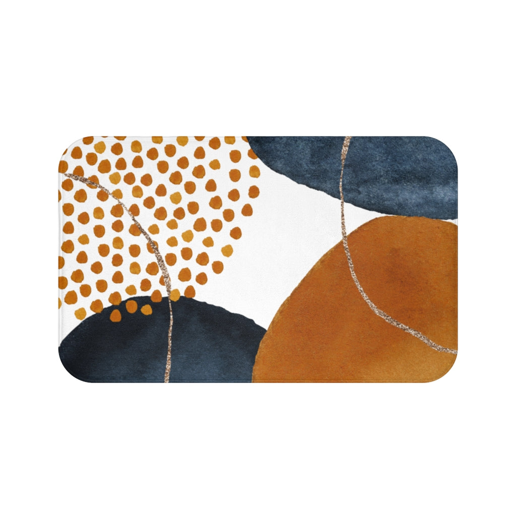 Navy blue and burnt orange boho bath mat in a modern bathroom