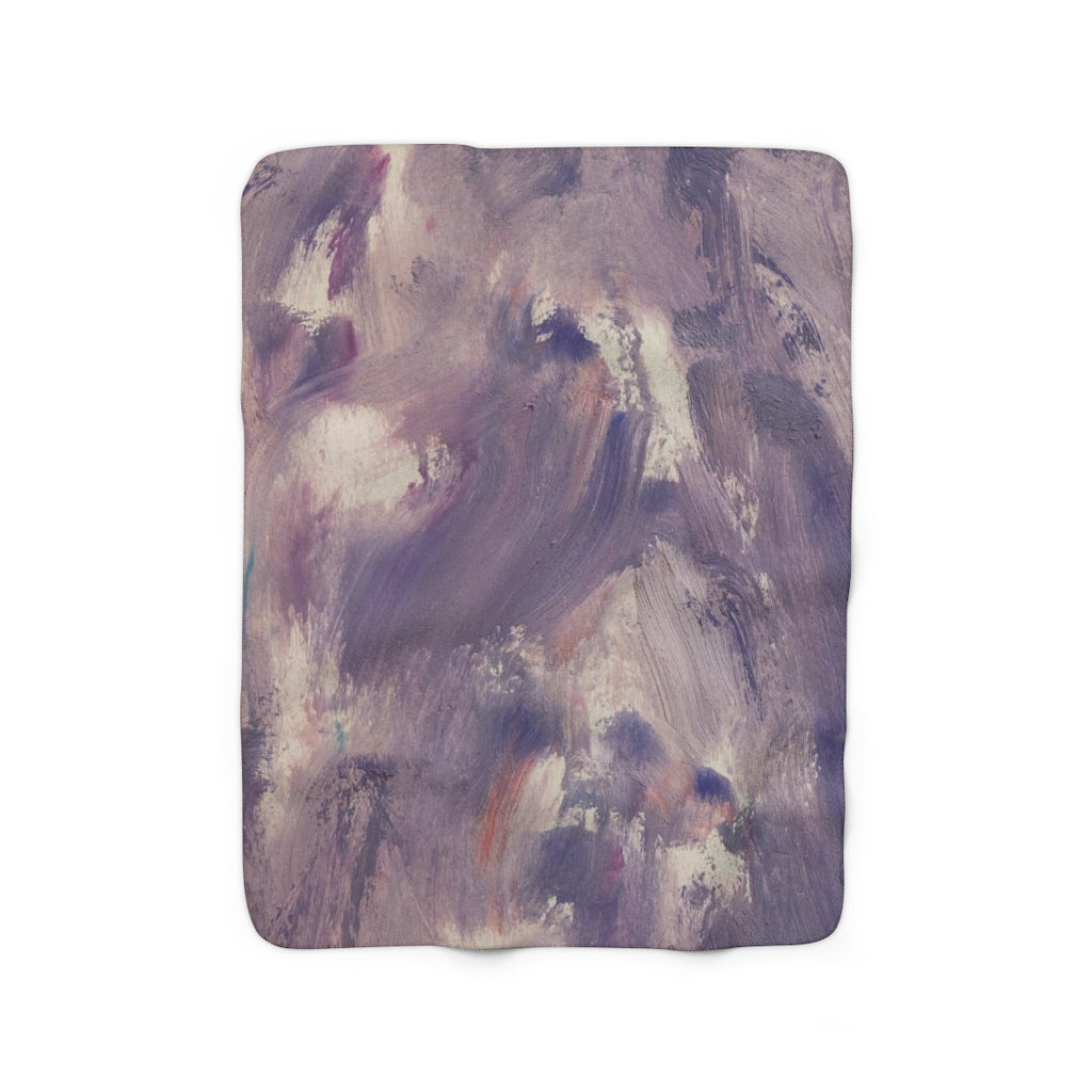 Lavender, purple and cream abstract comfy throw blanket draped over a sofa