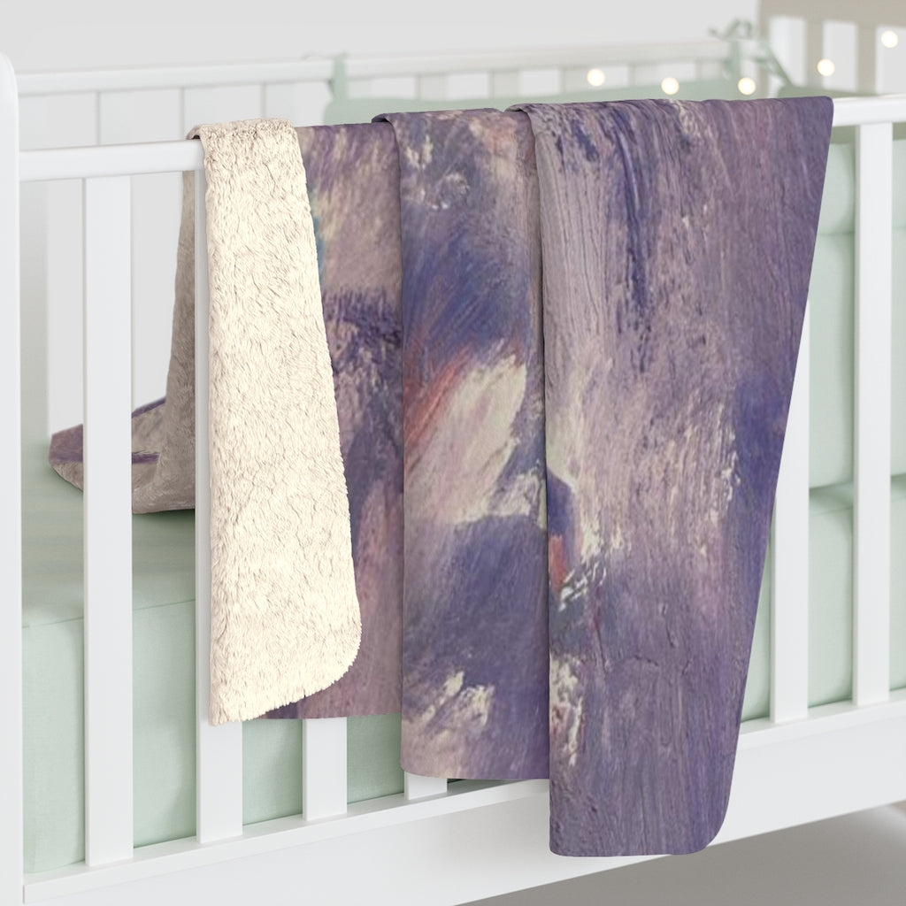 Lavender, purple and cream abstract comfy throw blanket styled in a cozy living room