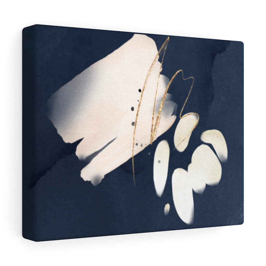 Navy blue, cream and white abstract wall canvas art hung above a sofa