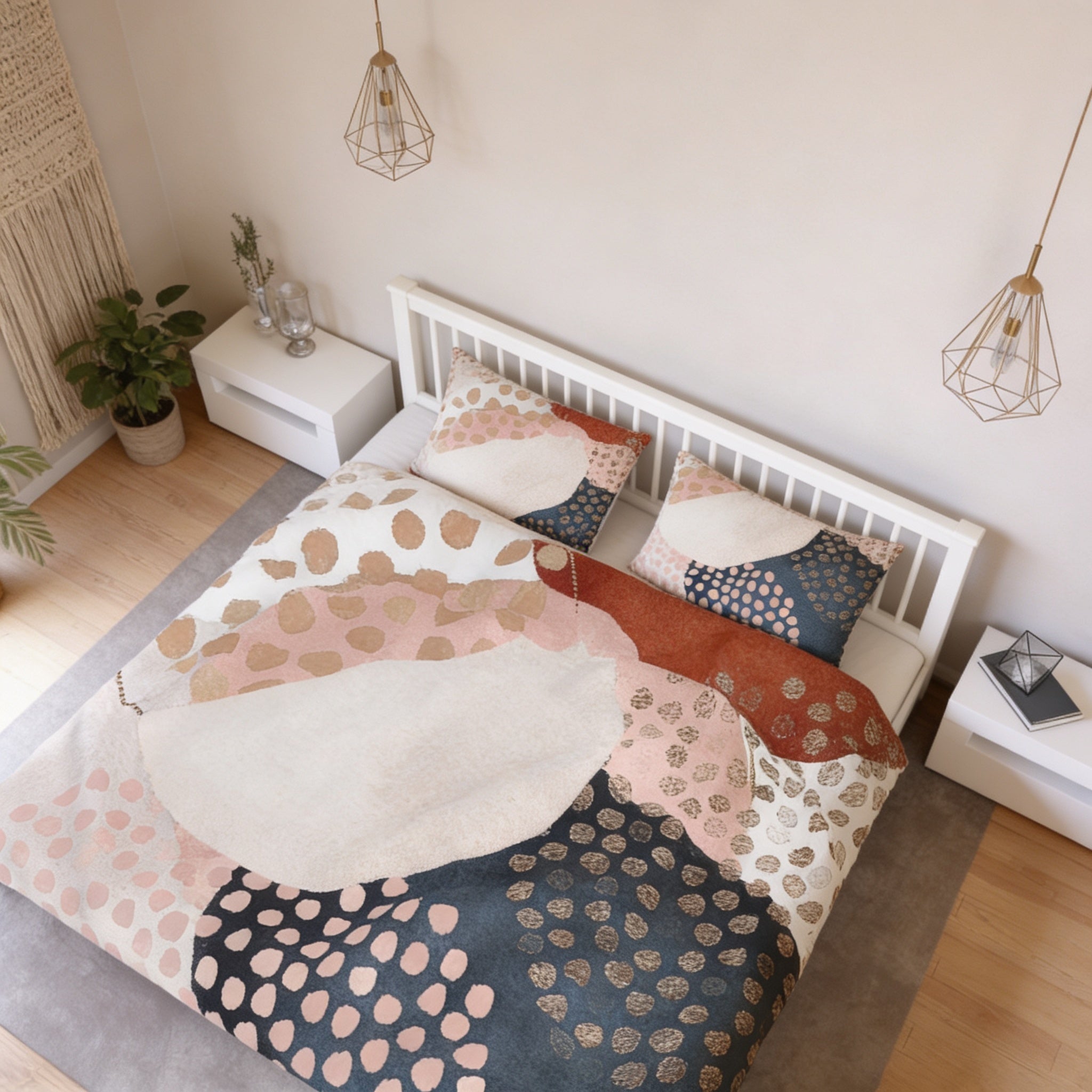 a bedroom with a bed featuring a colorful, abstract patterned comforter and pillows. The room has a minimalist and modern design, with white walls, a wooden floor, and pendant lights hanging above the bed.