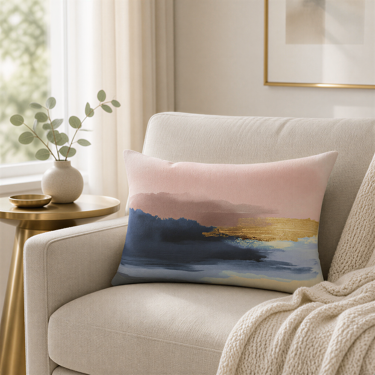 a cozy living room with a beige sofa, a gold side table, and a decorative pillow with a colorful abstract design.
