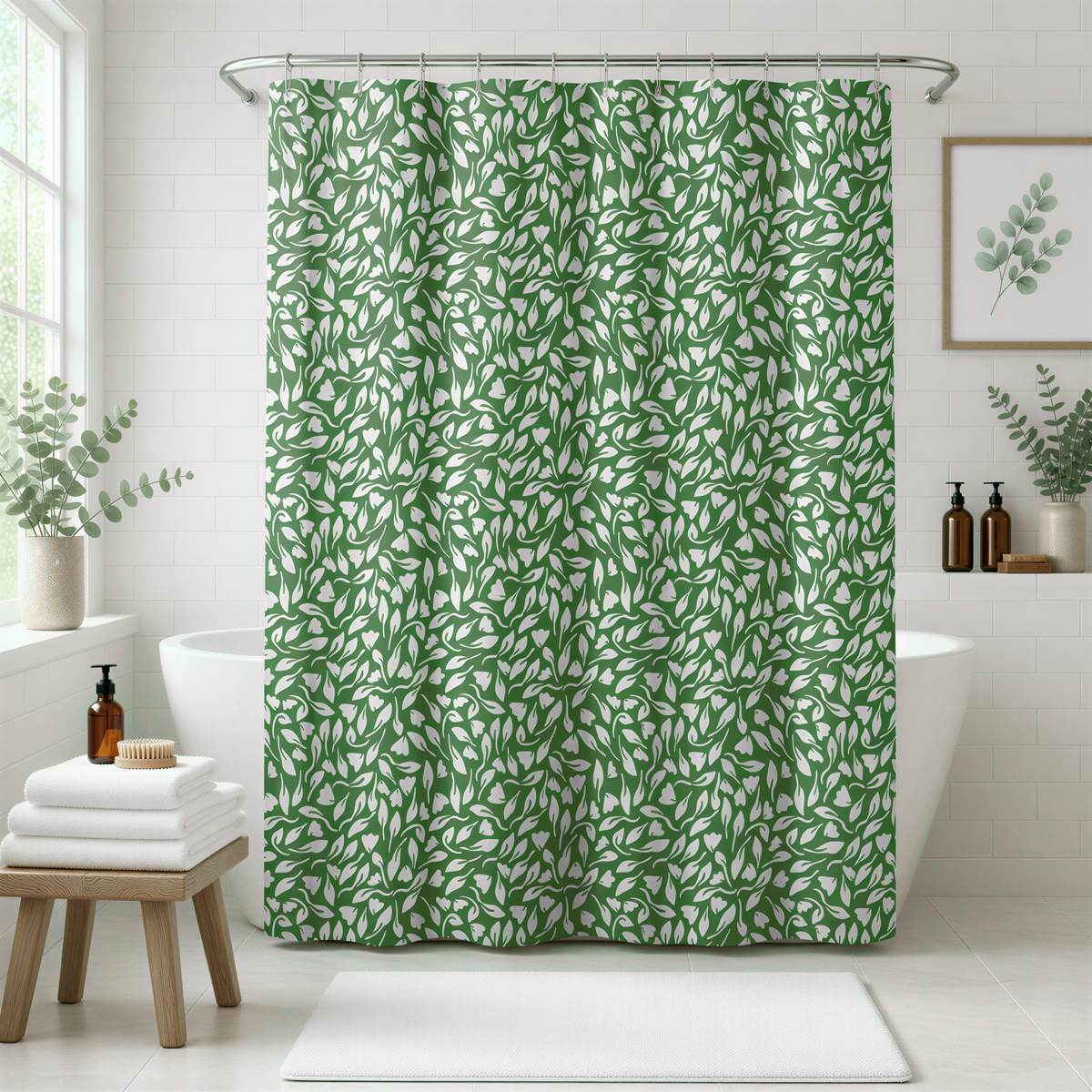 a bathroom with a green leafy patterned shower curtain, a wooden stool, and a framed plant on the wall.