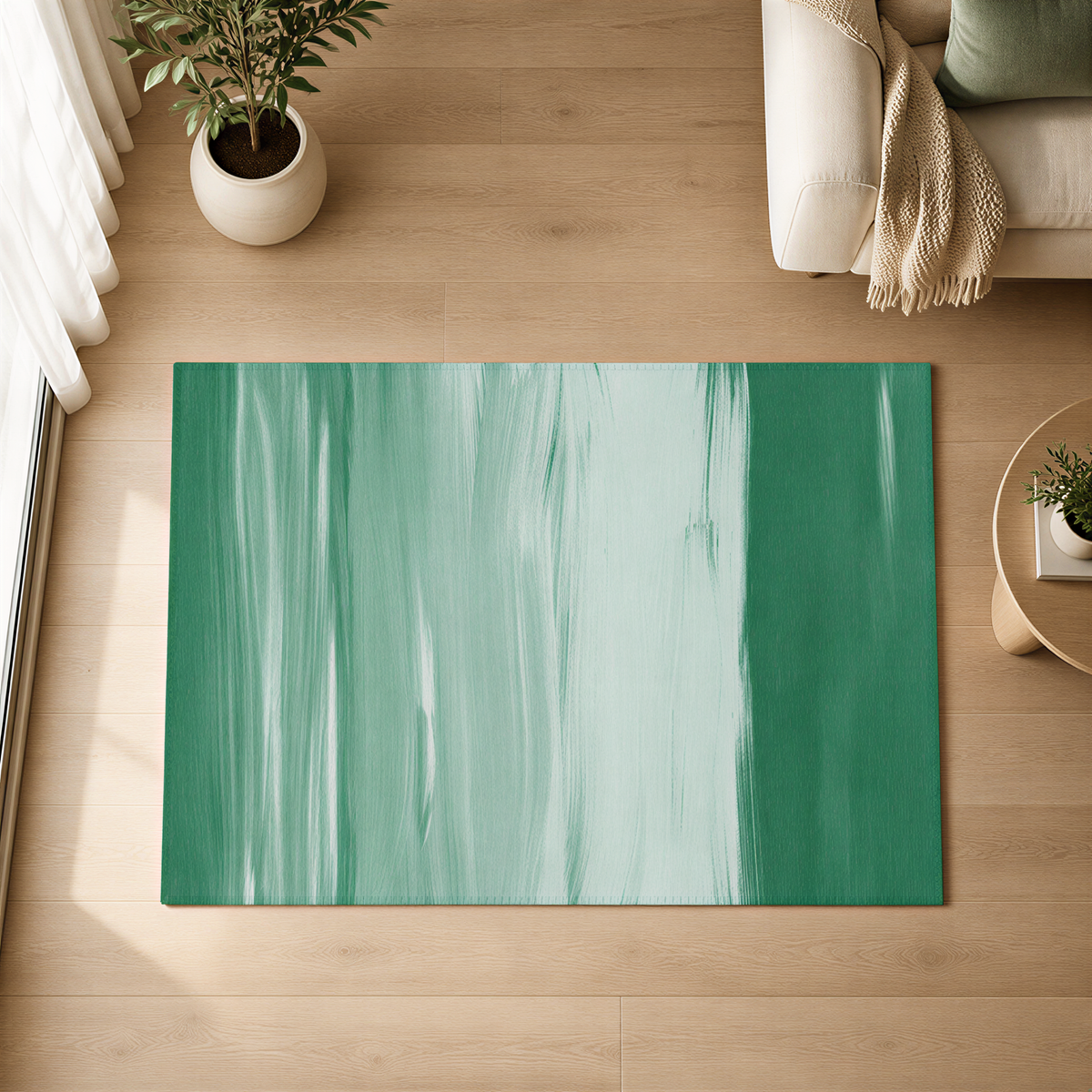 a large green and white abstract rug on a wooden floor, with a white sofa and a potted plant in the background.