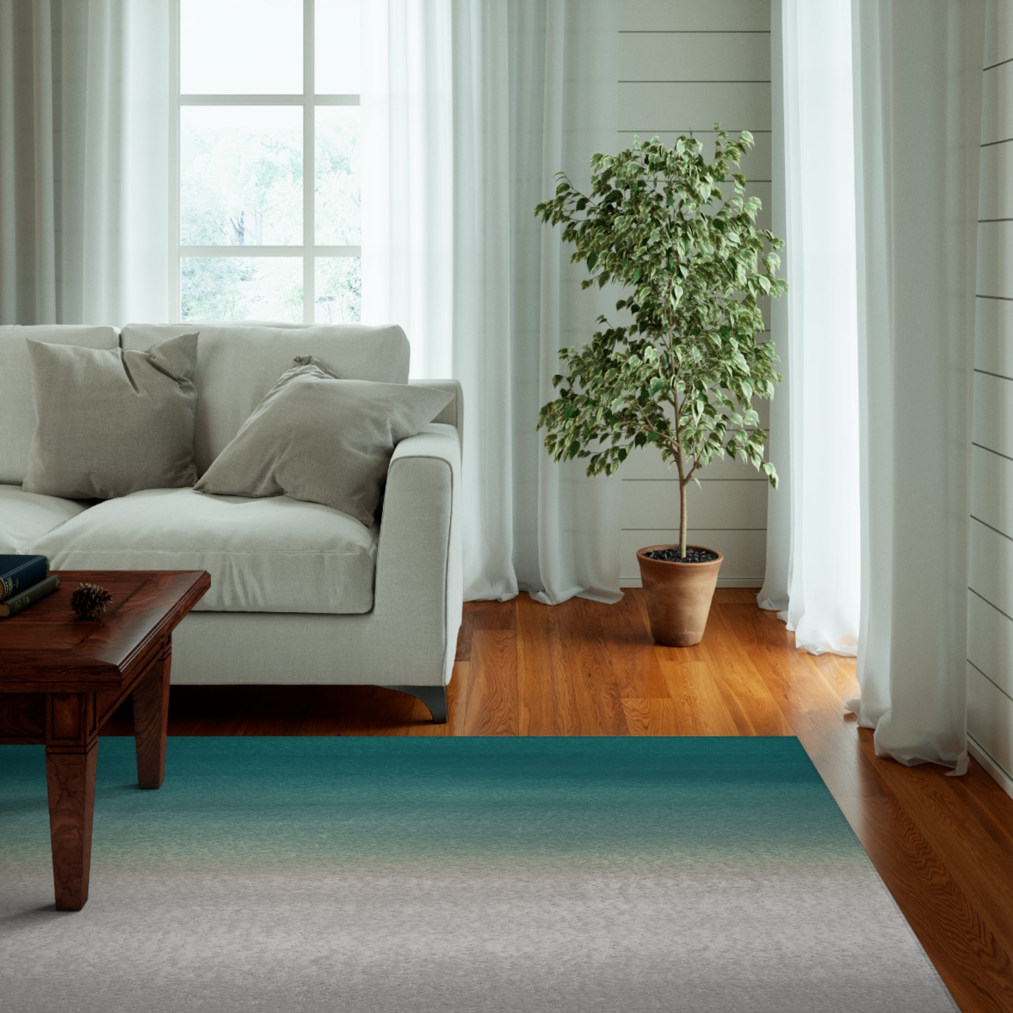 a living room with a couch, coffee table and a potted plant