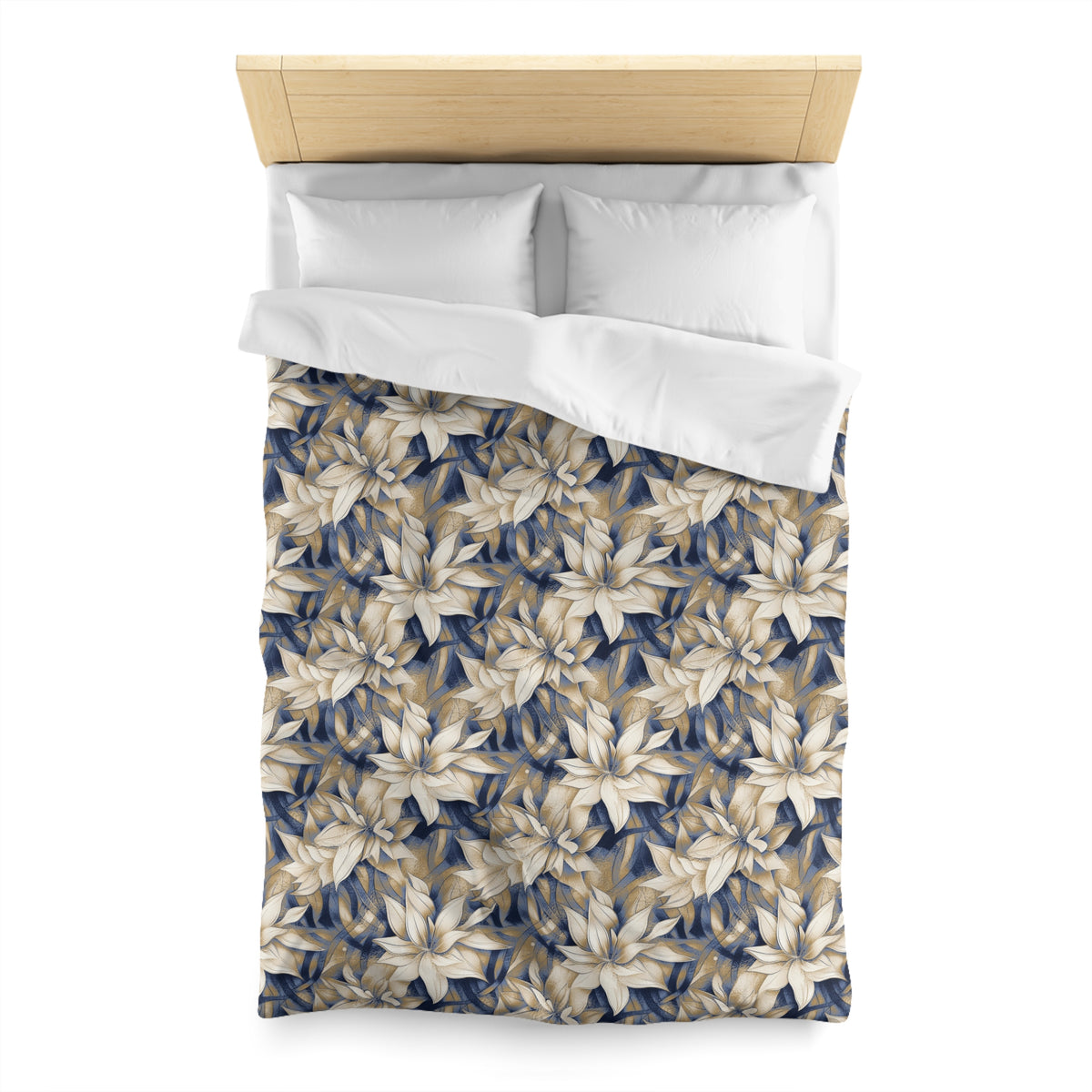 a bed with a floral print comforter and pillows.