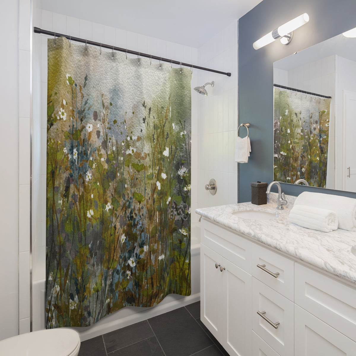 a modern bathroom with a white vanity, a shower curtain featuring a floral pattern, and a mirror above the vanity.