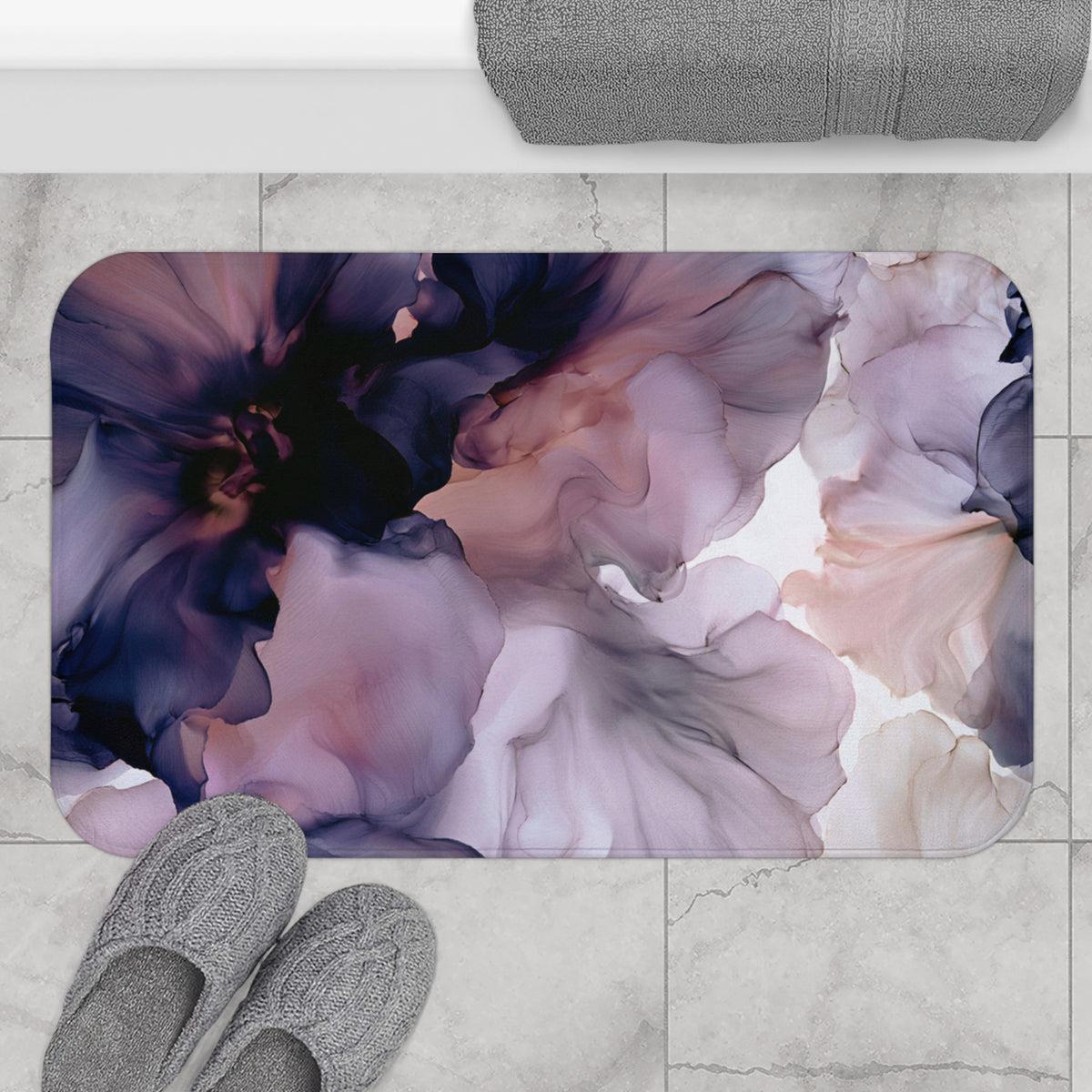 a bathroom rug with a flower design on it