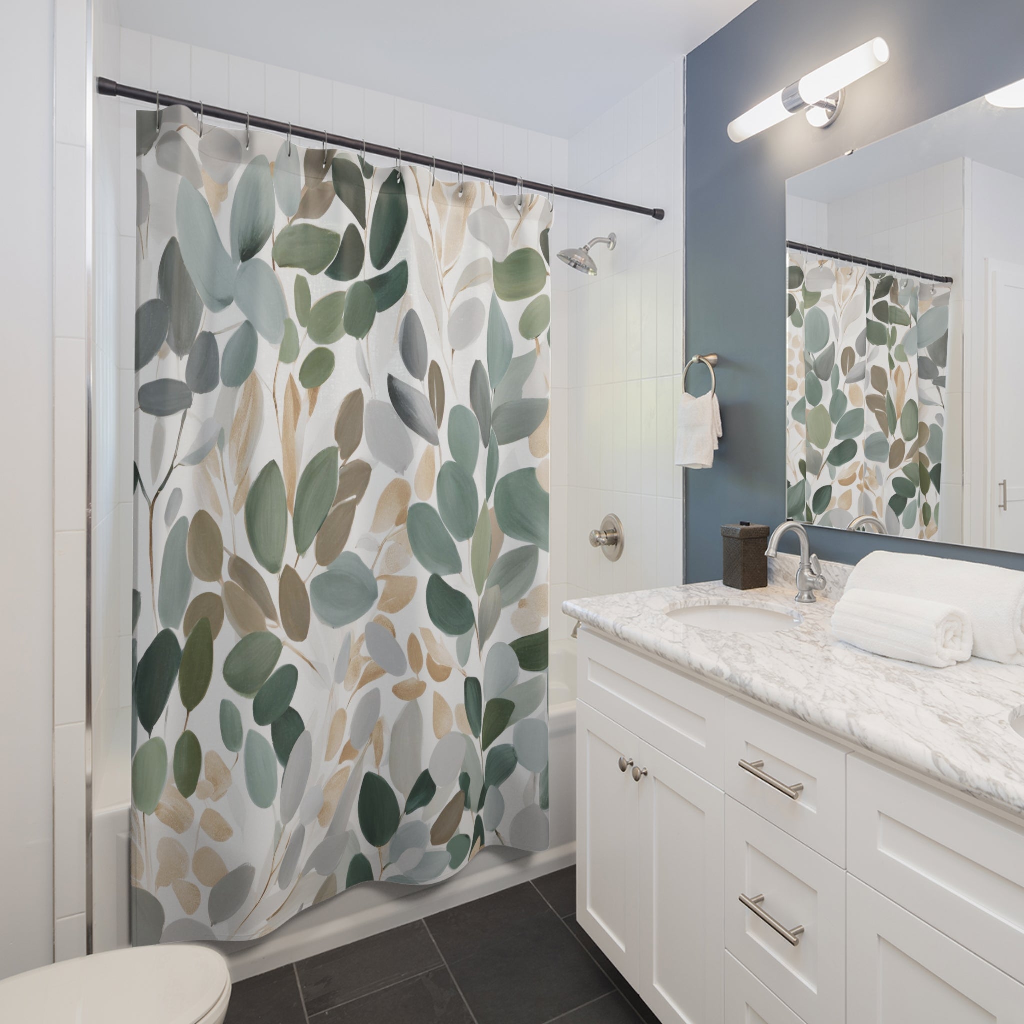 a modern bathroom with a white vanity, a shower curtain with a leaf pattern, and a mirror above the sink.