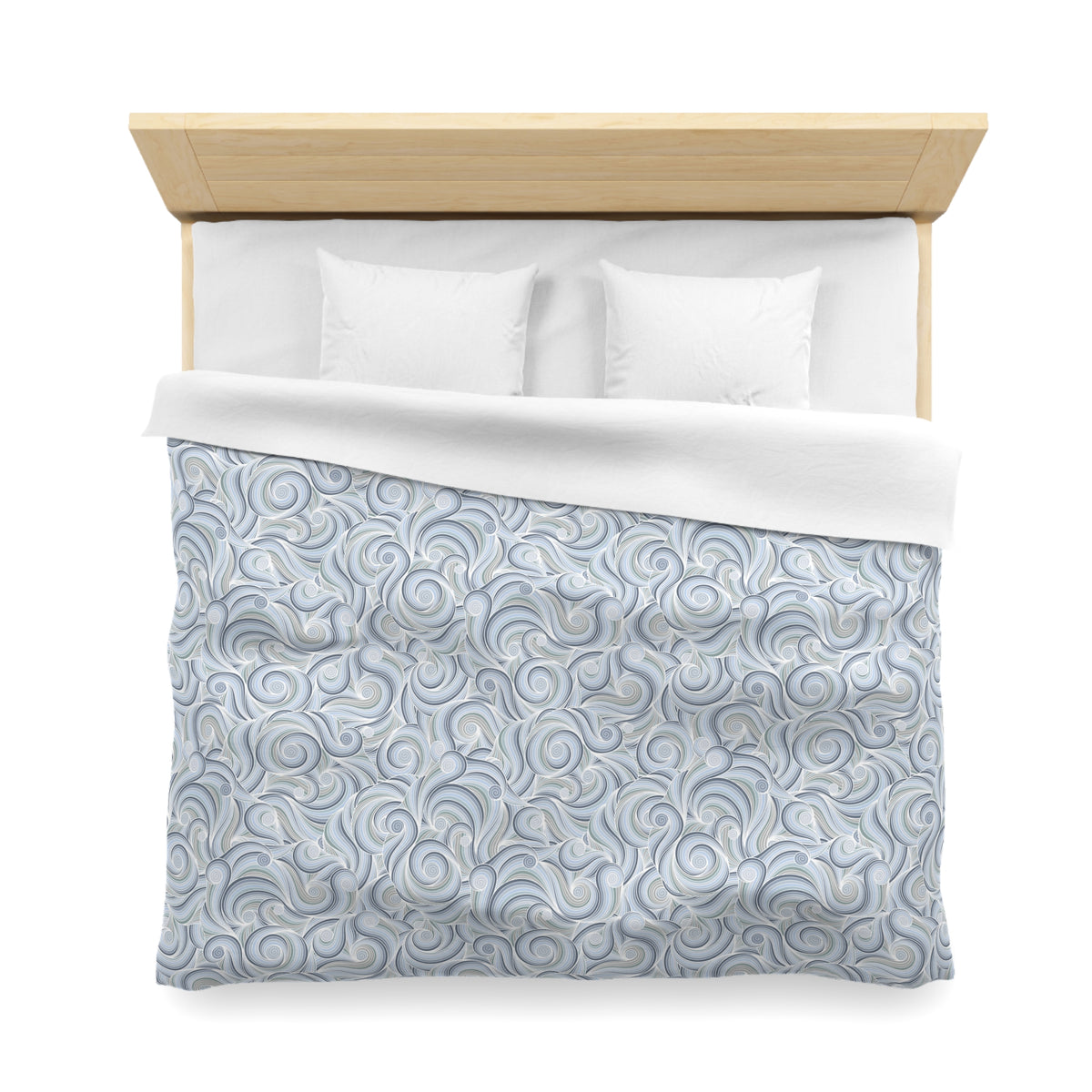a neatly made bed with a blue and white patterned comforter and two white pillows.