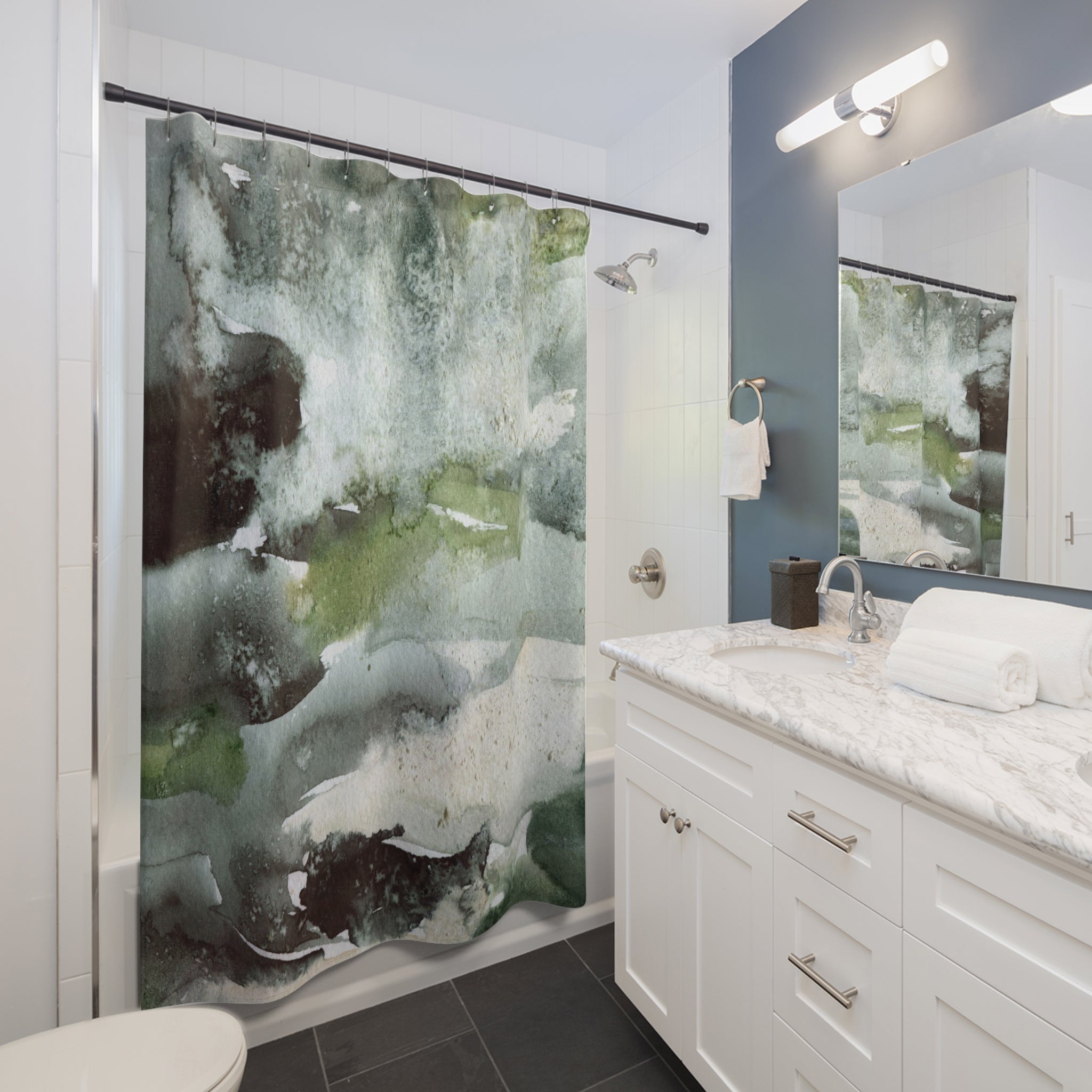 a modern bathroom with a white vanity, a large abstract green and white shower curtain, and a mirror above the sink.