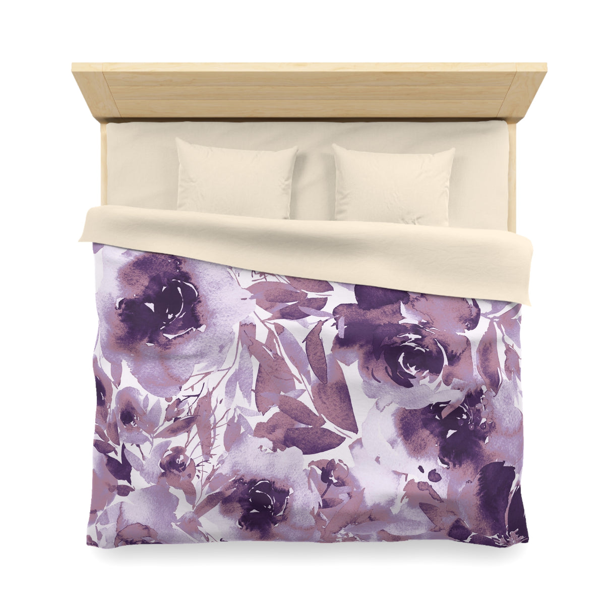 a neatly made bed with a floral print duvet cover and two pillows.