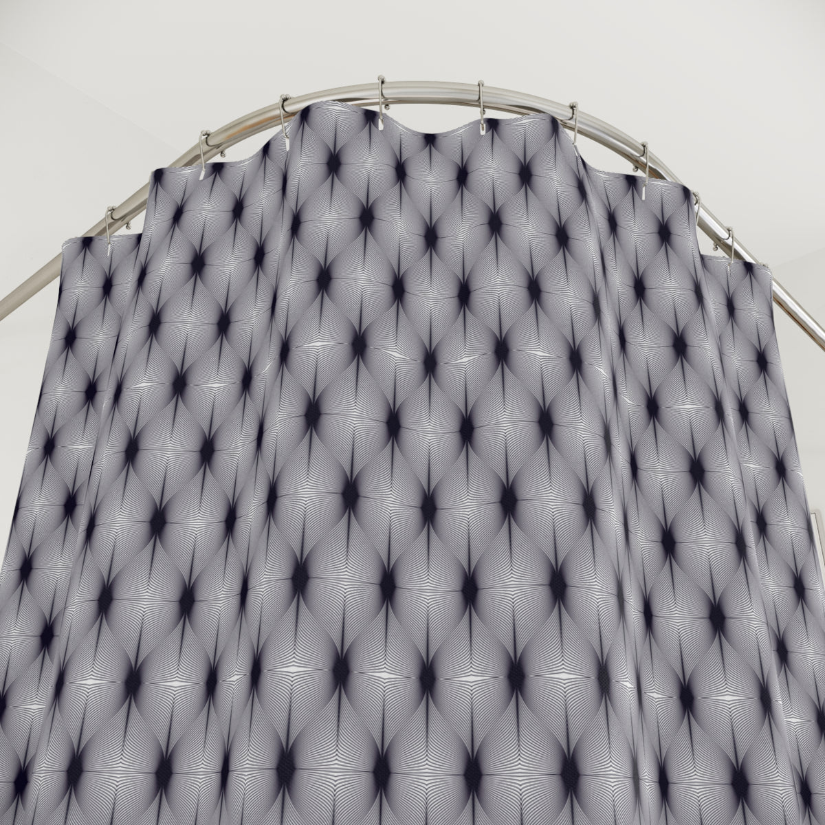 a curved metal structure with a repeating pattern of black and white geometric shapes, creating a visually striking and abstract design.