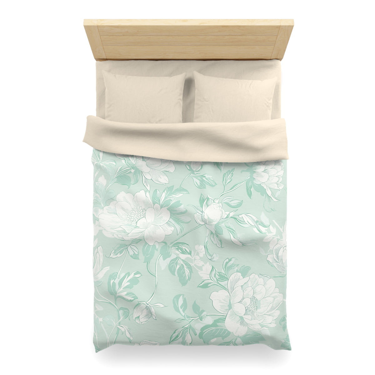 A neatly made bed with a floral patterned comforter and pillows.