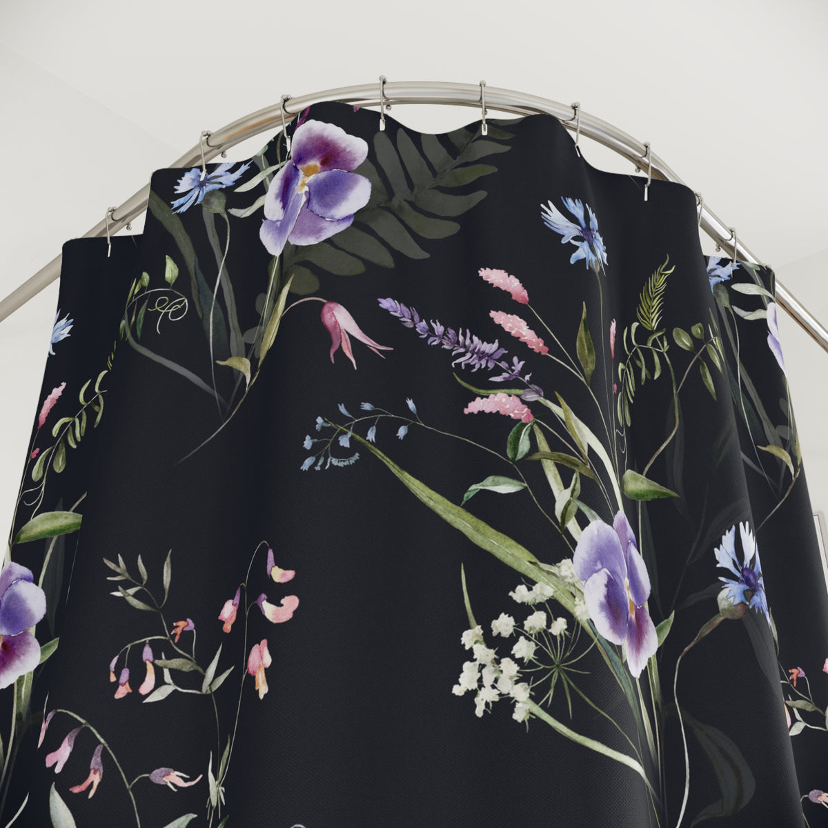 a black shower curtain with a floral pattern of purple and pink flowers, along with green leaves and other natural elements.