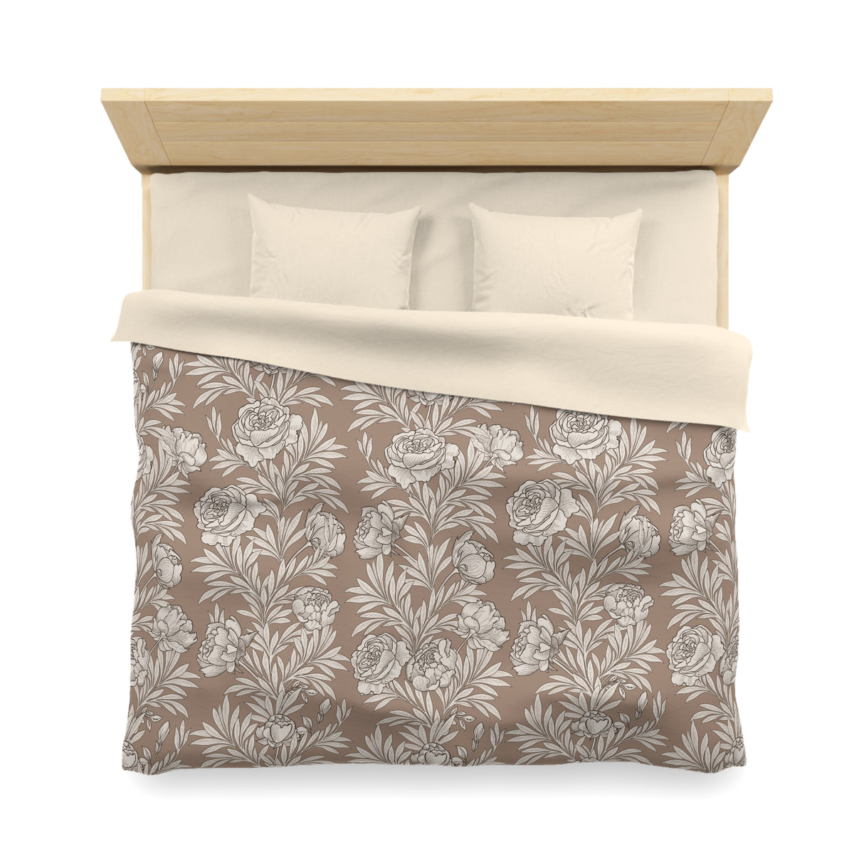 A neatly made bed with a floral patterned comforter and pillows.