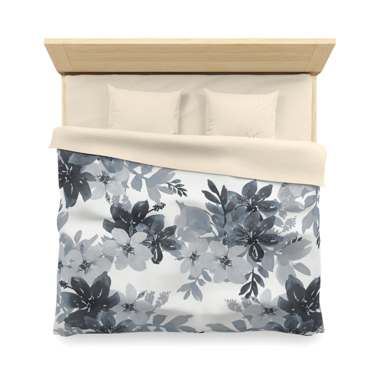a neatly made bed with a floral print duvet cover and two pillows.