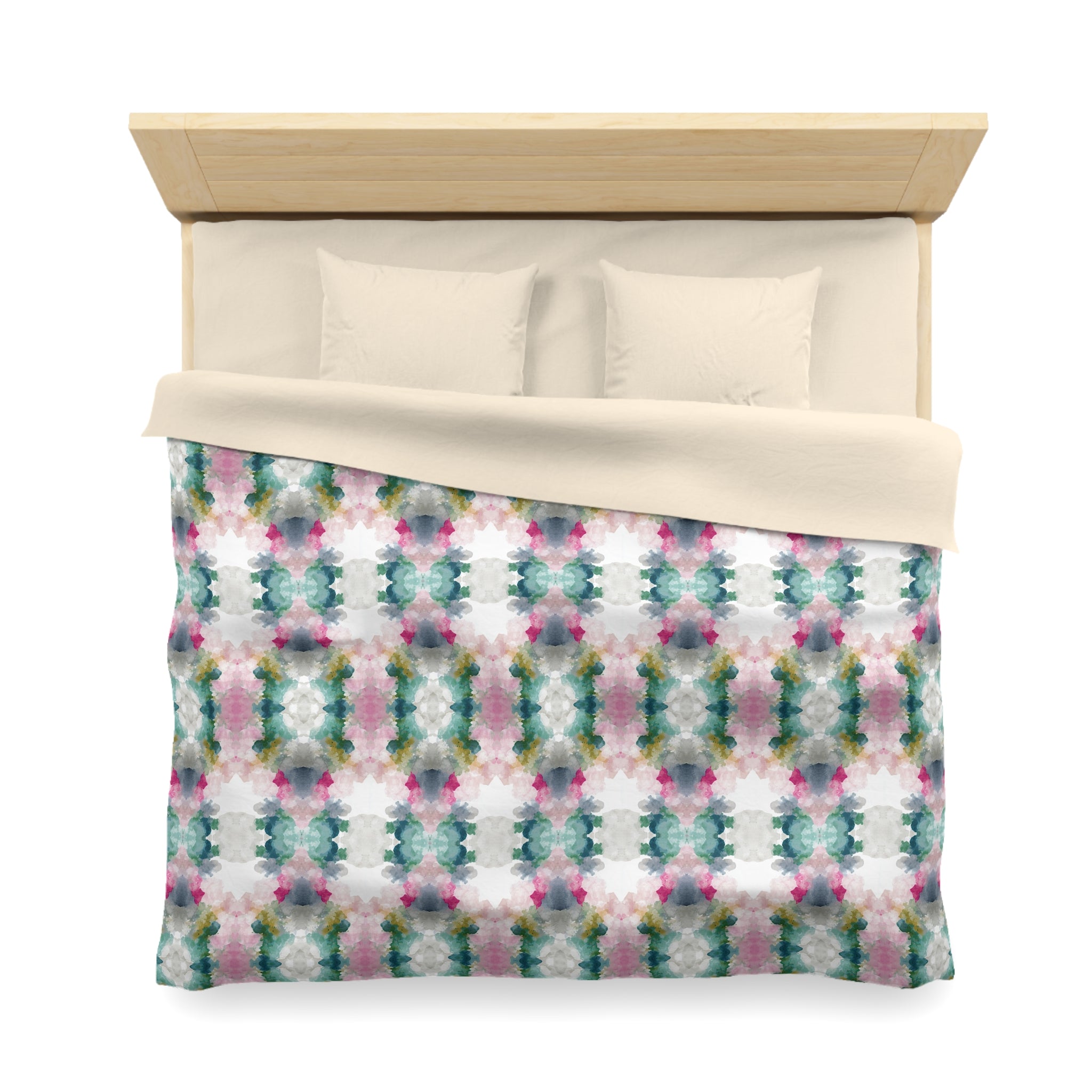 a neatly made bed with a colorful, patterned comforter and pillows.