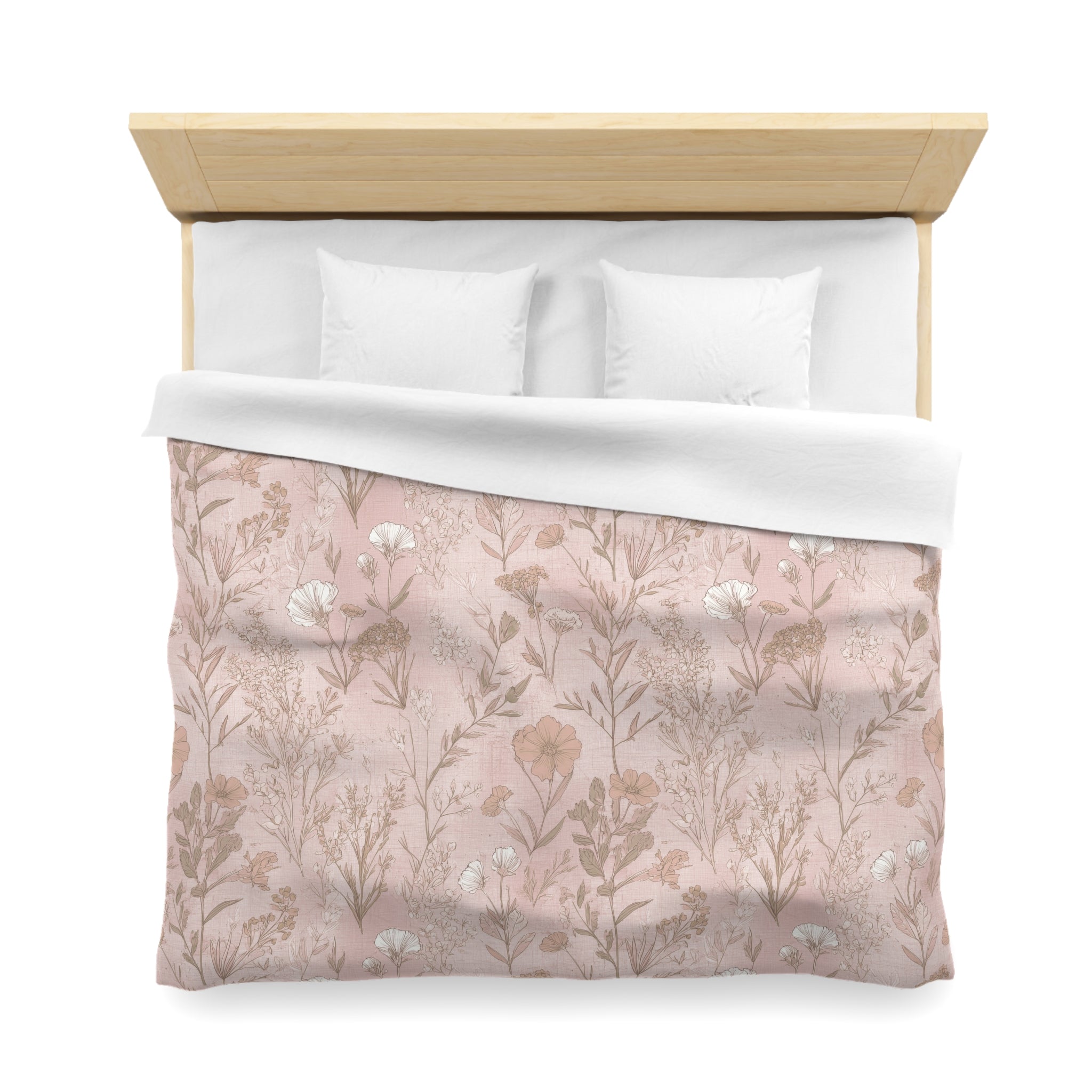 a neatly made bed with a floral patterned comforter and pillows.