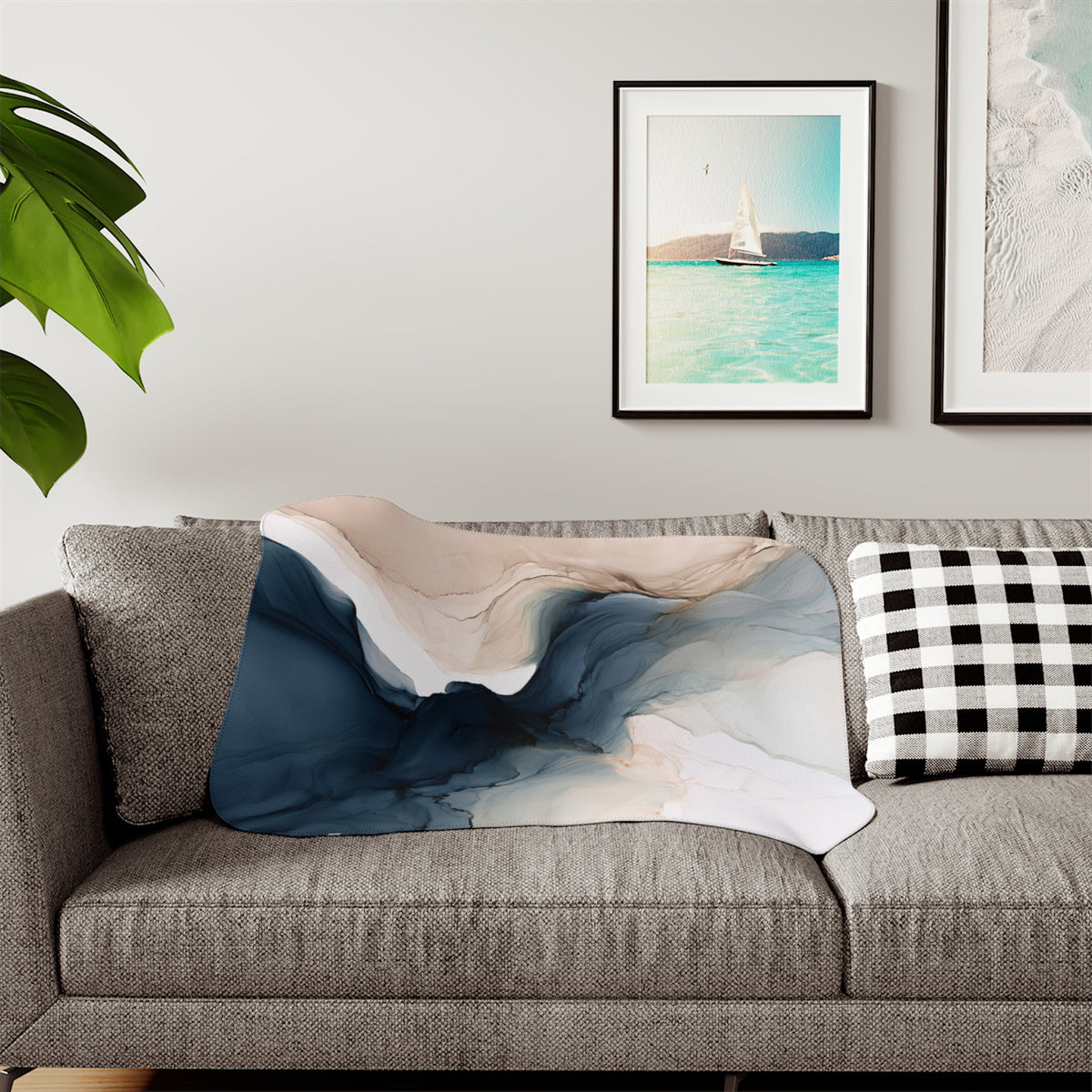 a living room with a couch and two pictures on the wall
