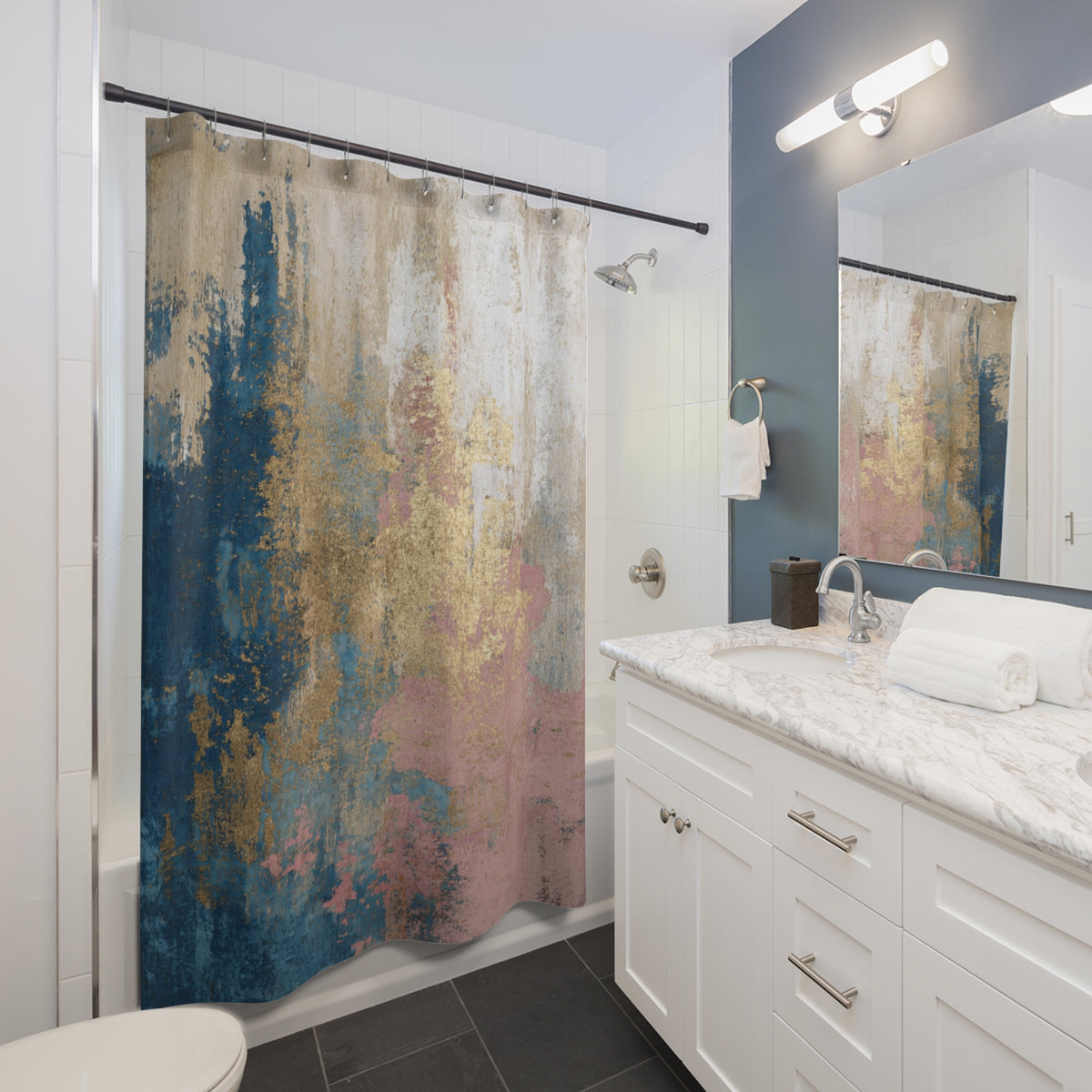 a modern bathroom with a white vanity, a shower curtain with a colorful abstract design, and a mirror above the vanity.