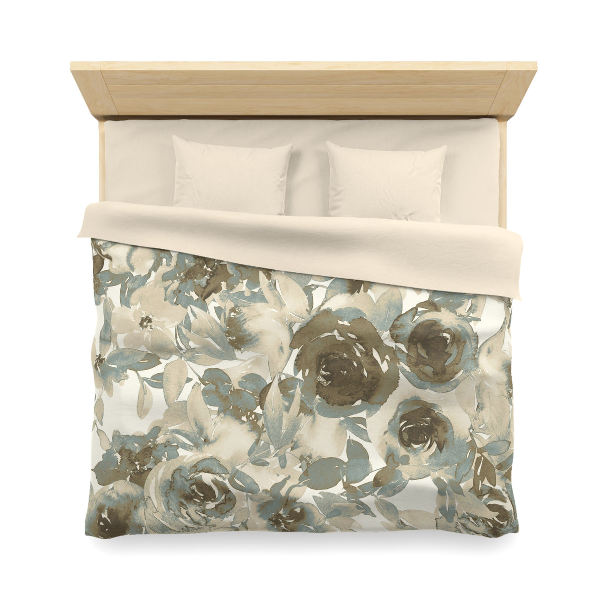 a neatly made bed with a floral print comforter and pillows.