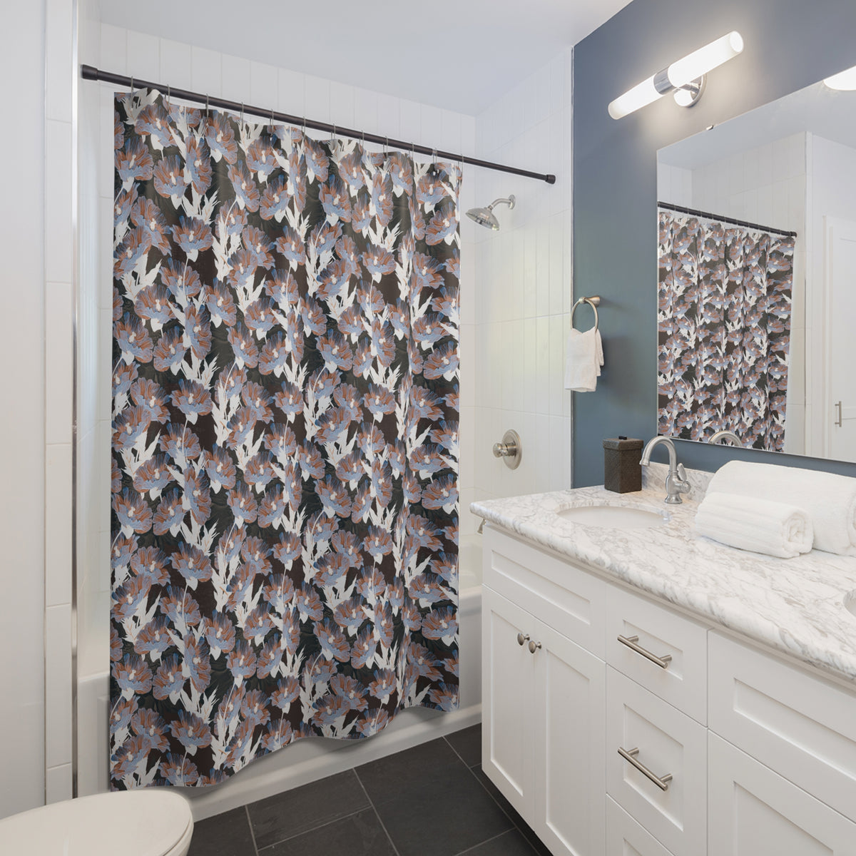 a modern bathroom with a white vanity, a shower curtain with a floral pattern, and a mirror above the vanity.