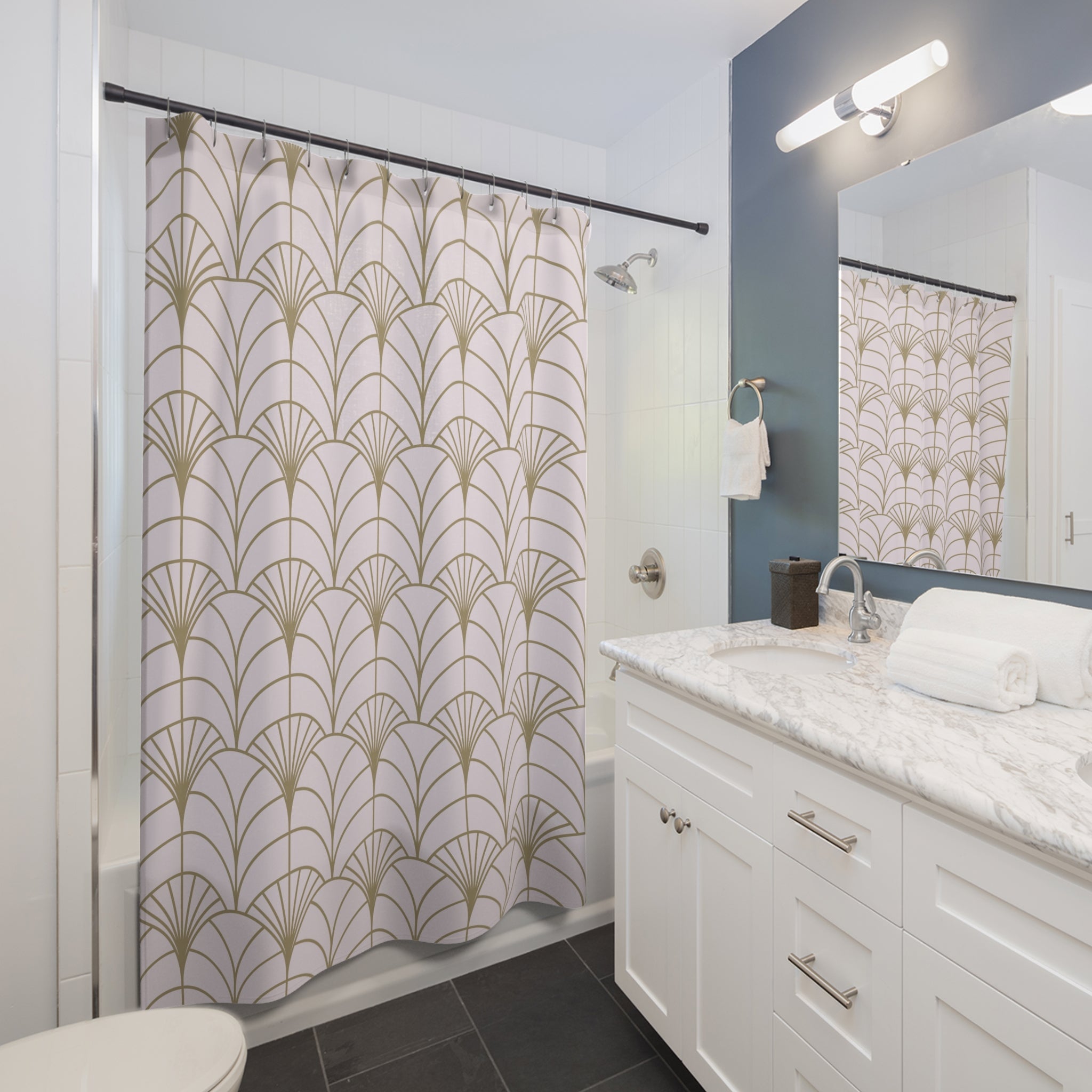 a modern bathroom with a white vanity, a shower curtain with a gold leaf pattern, and a marble countertop.
