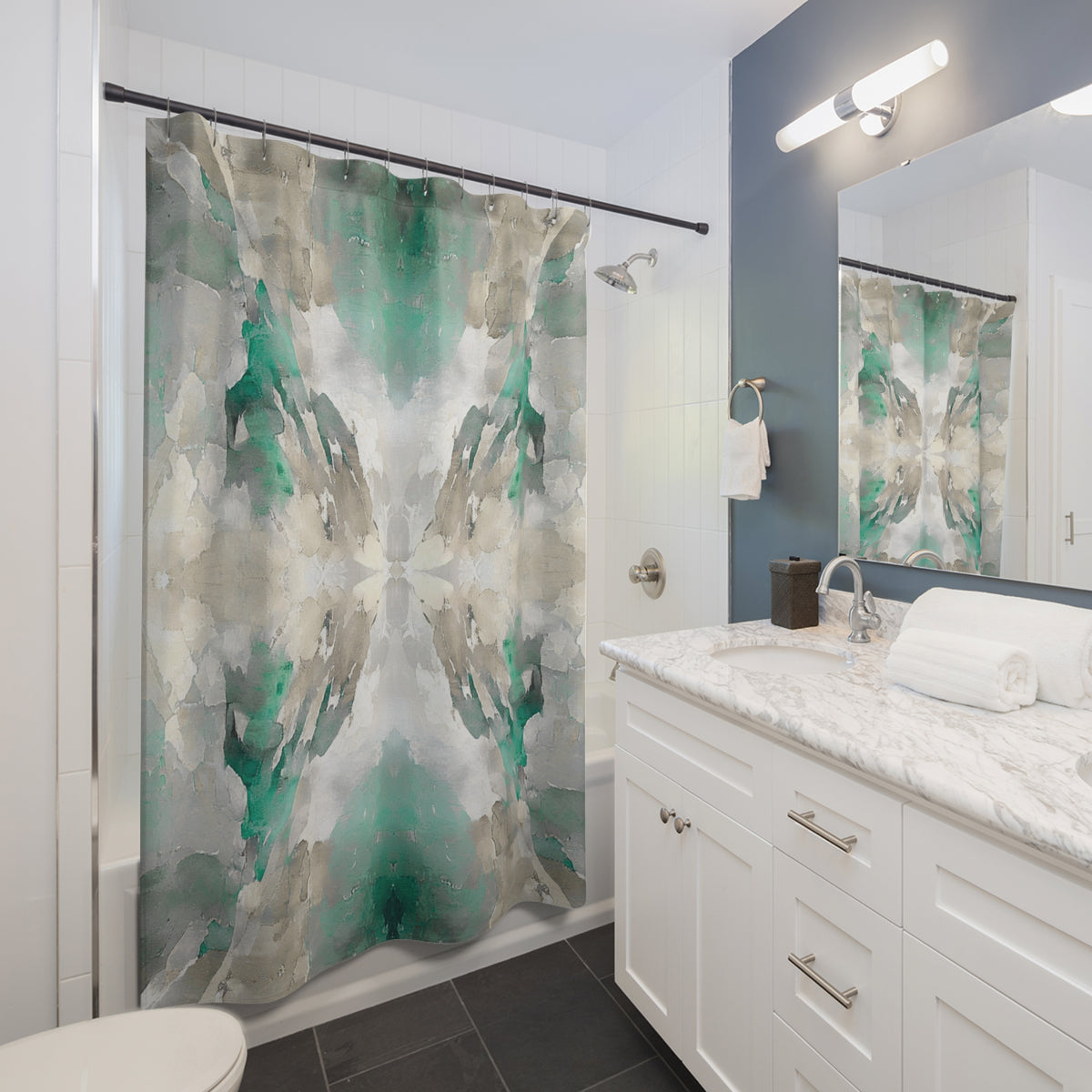 a modern bathroom with a white vanity, a large abstract green and gray shower curtain, and a mirror above the sink.