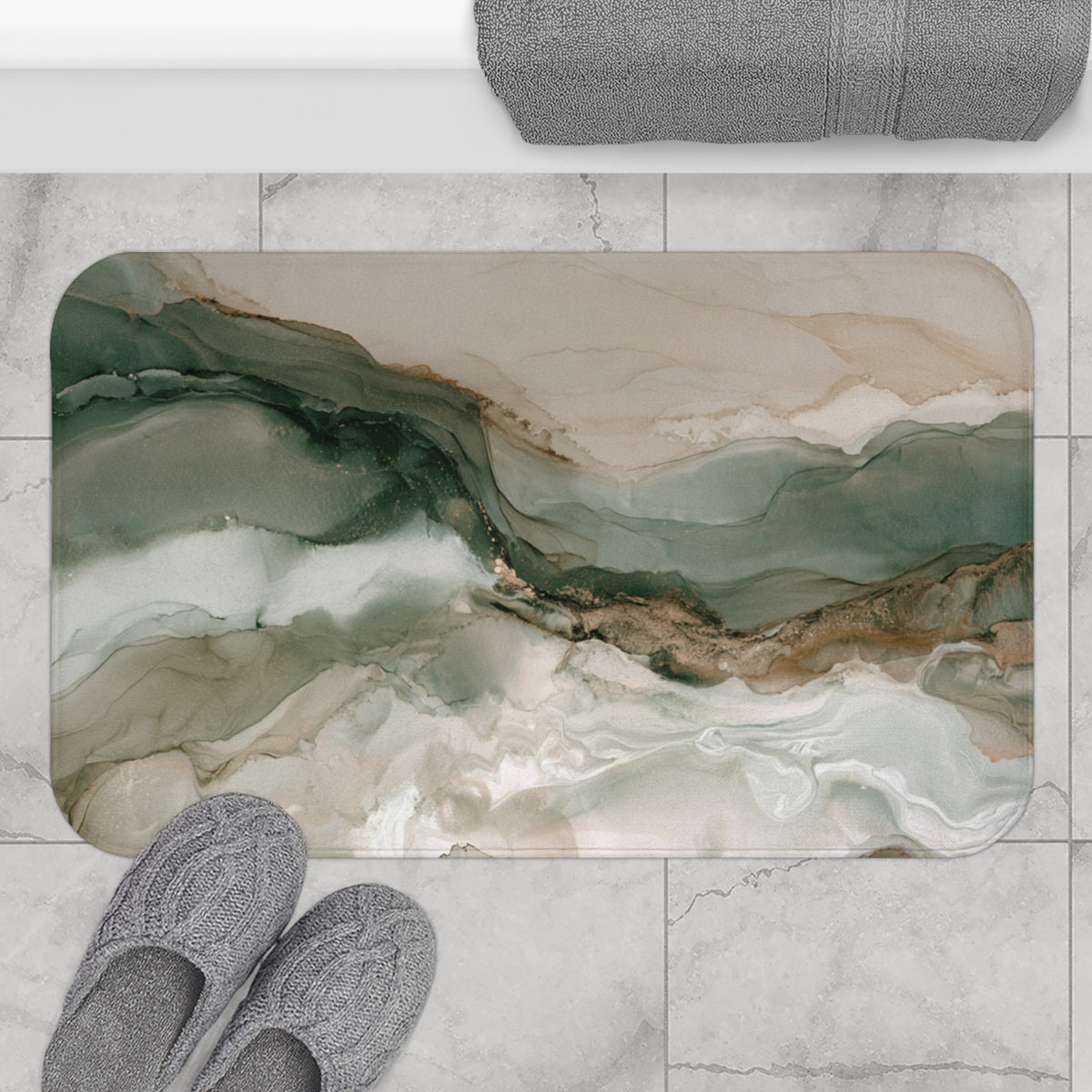 a bathroom mat with a marble-like texture and a landscape-inspired abstract design. The mat is placed on a tiled floor, and there are gray slippers positioned next to it.