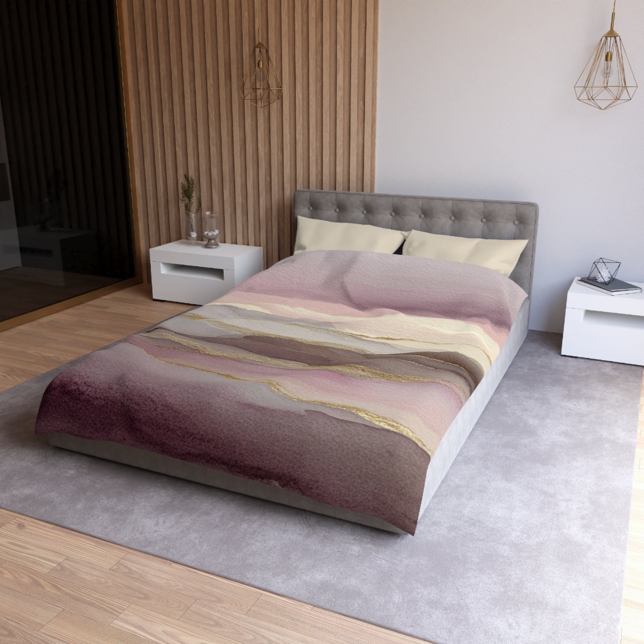 a modern bedroom with a large bed, a gray headboard, and a colorful bedspread featuring a gradient of pink and purple hues. The room has a neutral color scheme with white walls and a wooden floor, and there are two nightstands on either side of the bed.