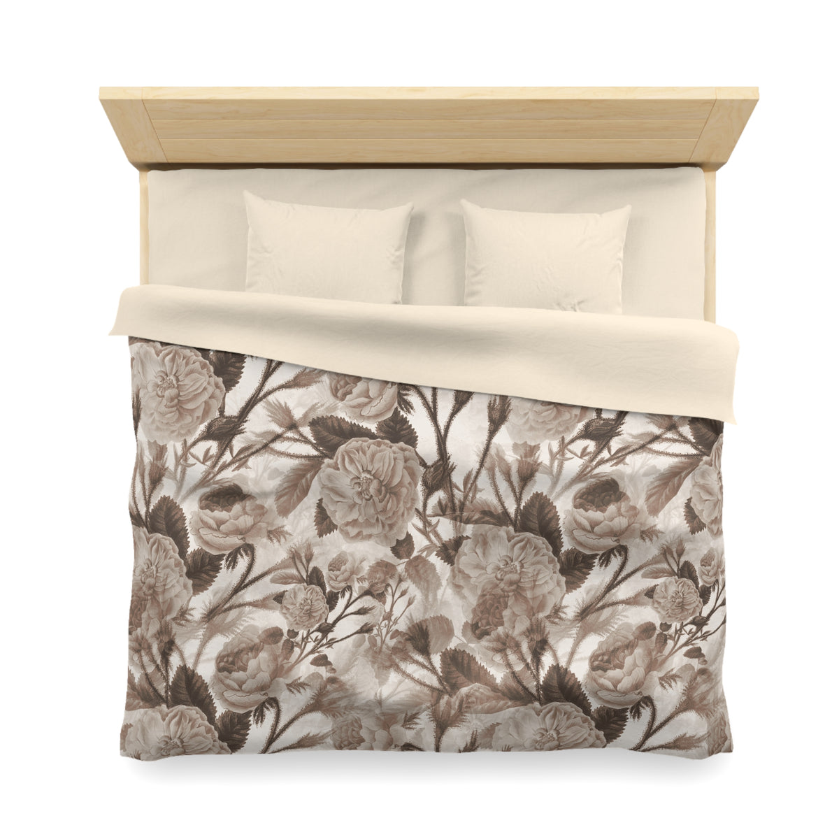 a neatly made bed with a floral print comforter and two pillows.