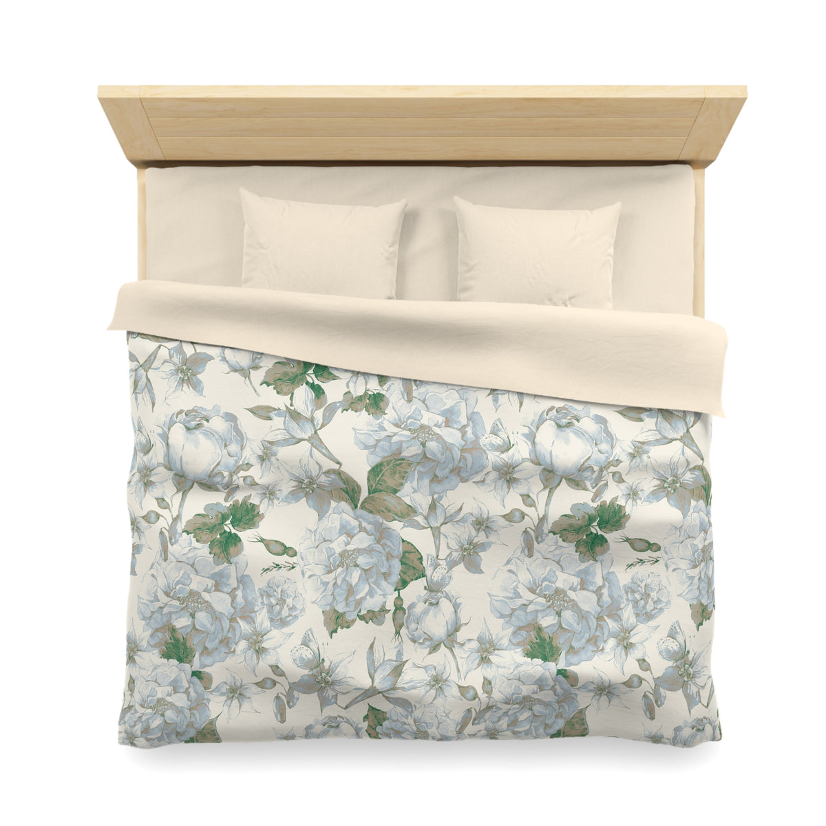 a neatly made bed with a floral print comforter and pillows.